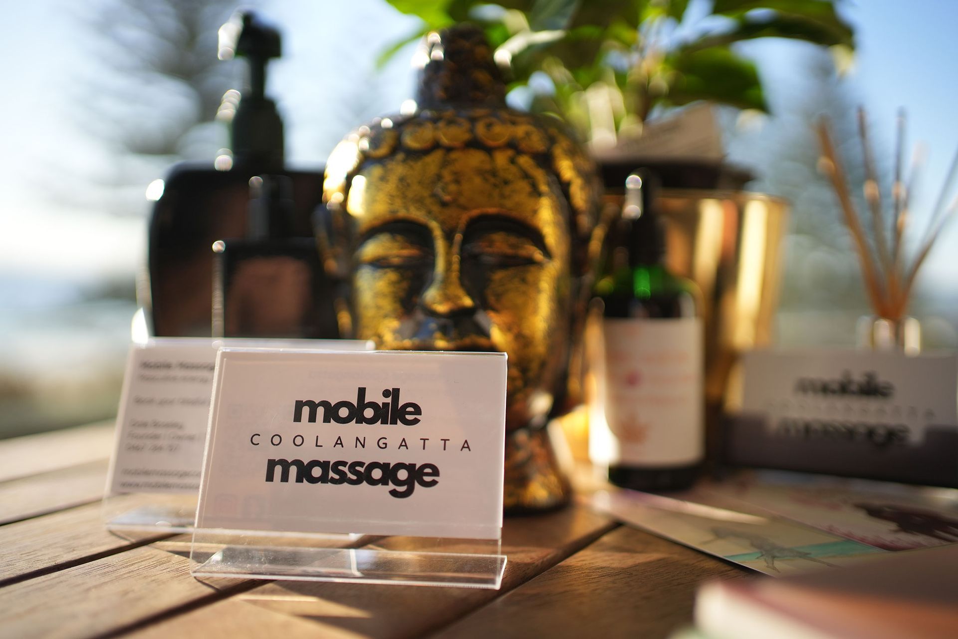 A Mobile Massage Sign Is On A Wooden Table – Coolangatta, QLD - Mobile Massage Coolangatta