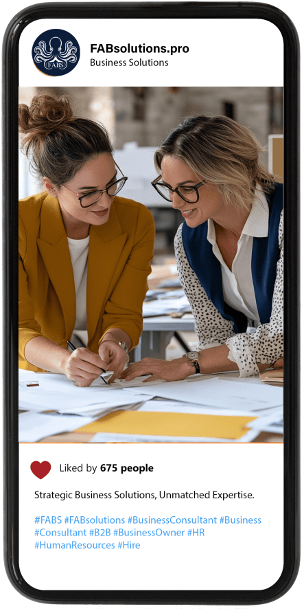Two women are sitting at a table looking at a reports Two women are sitting at a table looking at a reports