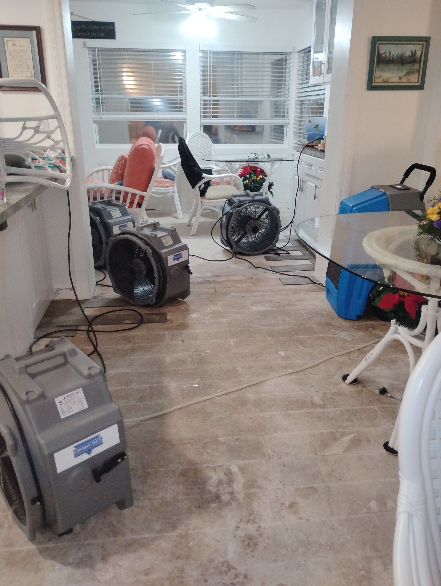A living room filled with furniture and a vacuum cleaner.