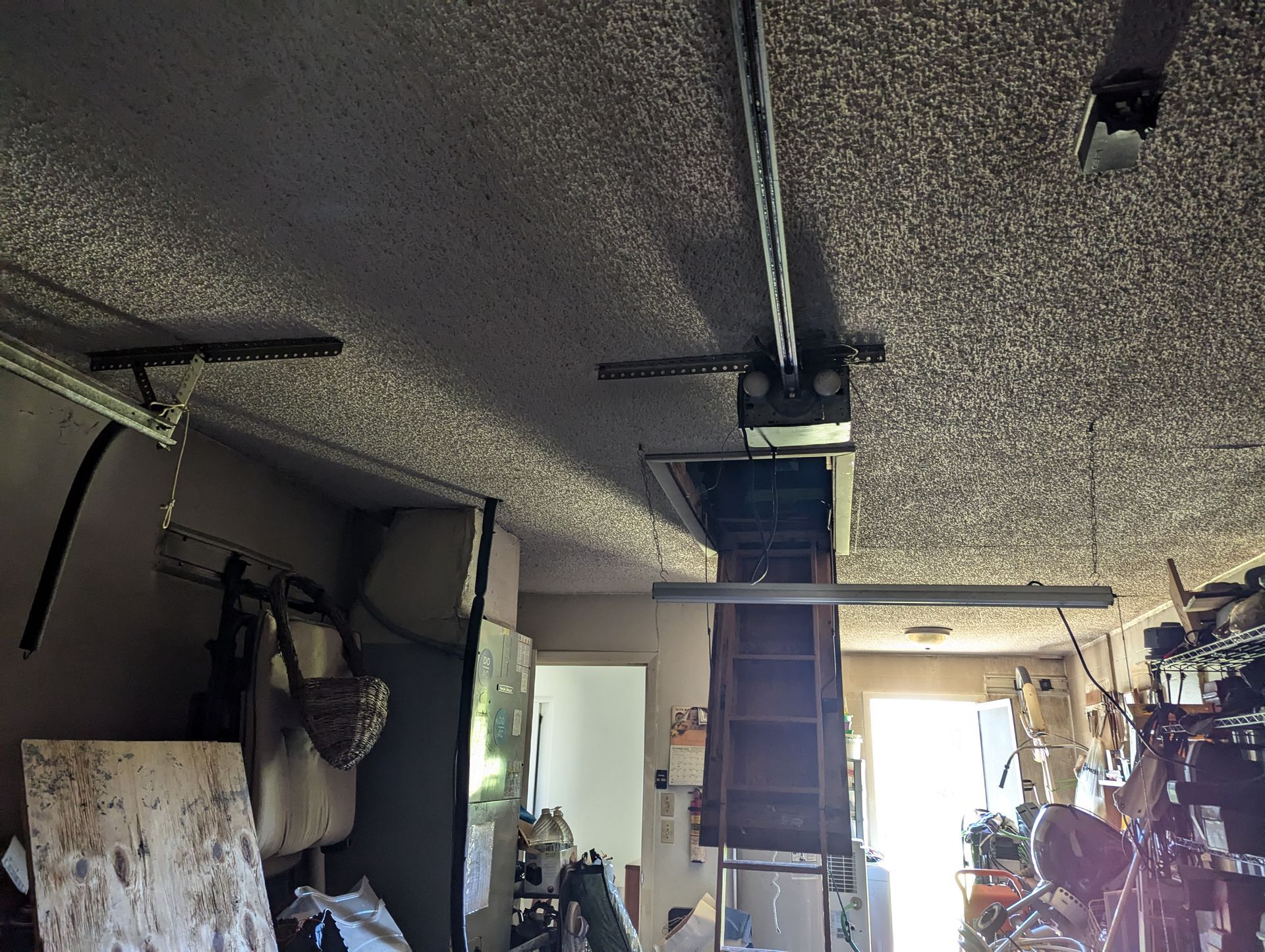 A garage with a ceiling that has a lot of dust on it