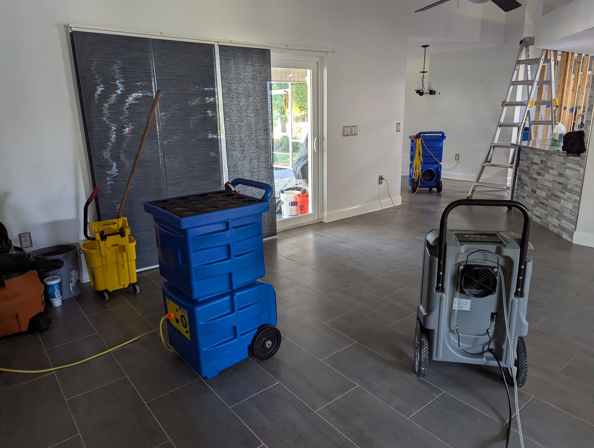 A room with a lot of cleaning equipment in it.