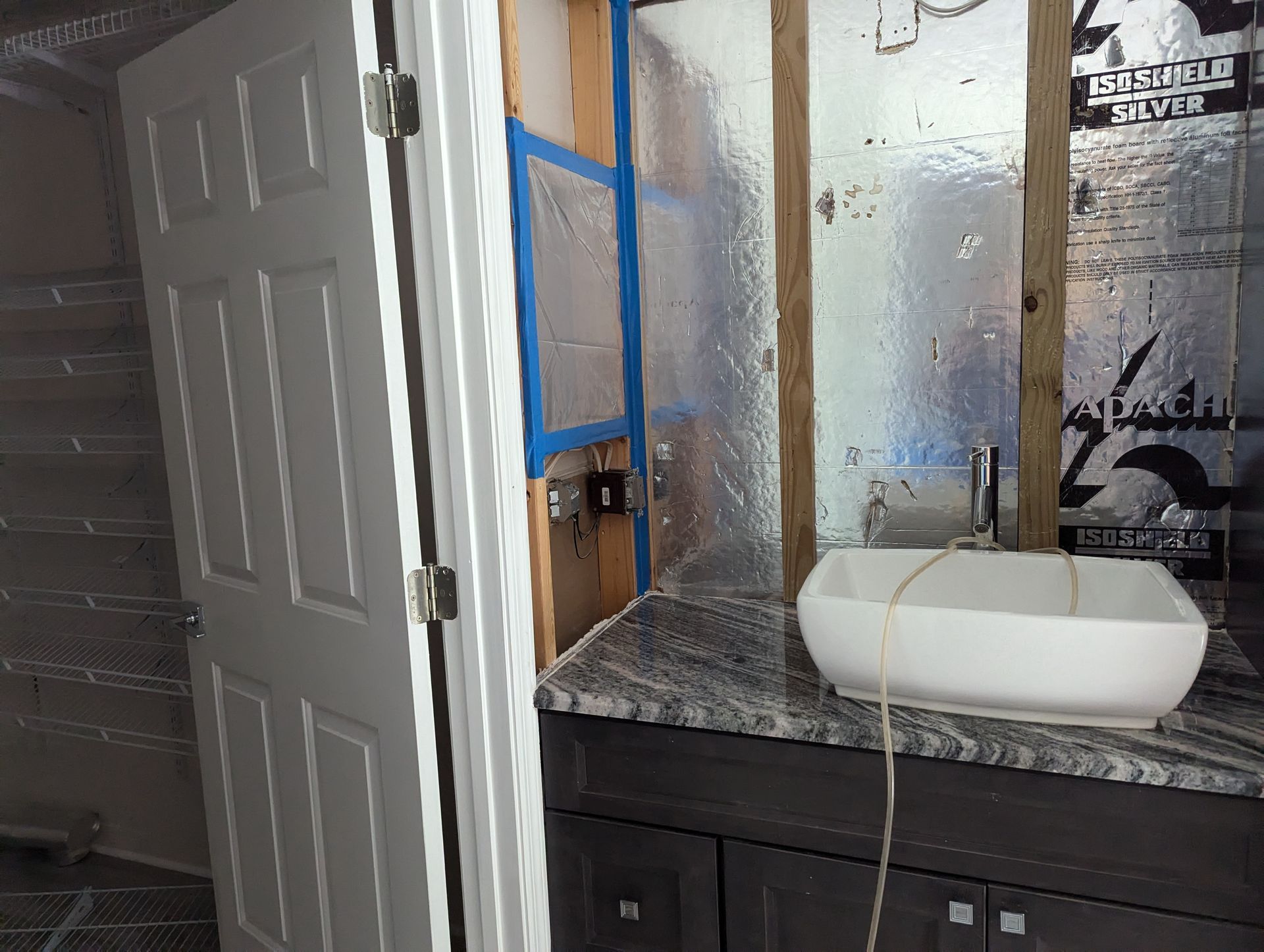 A bathroom with a sink and a mirror.