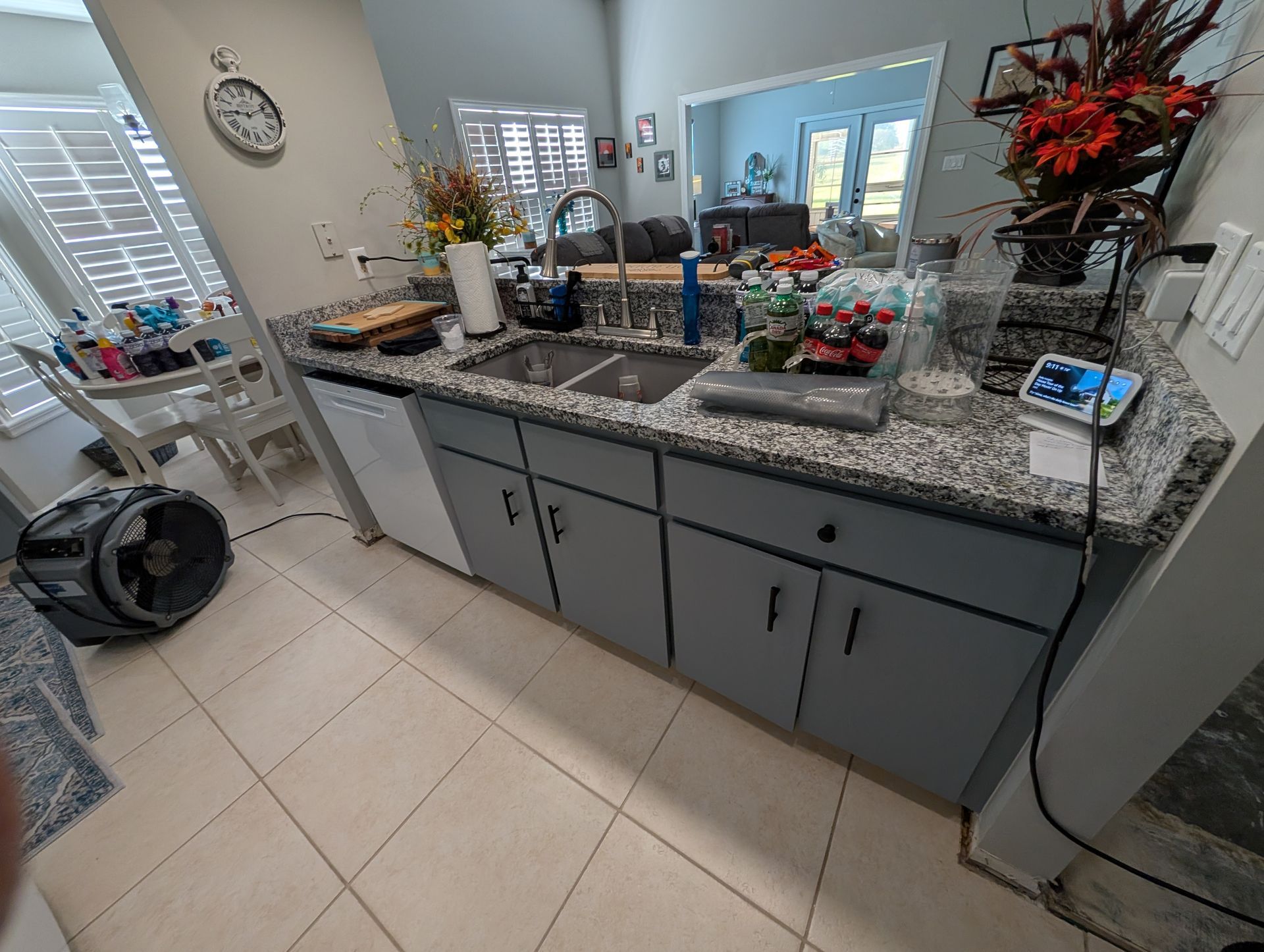 Kitchen with a granite countertop, cabinets, sink, and appliances.