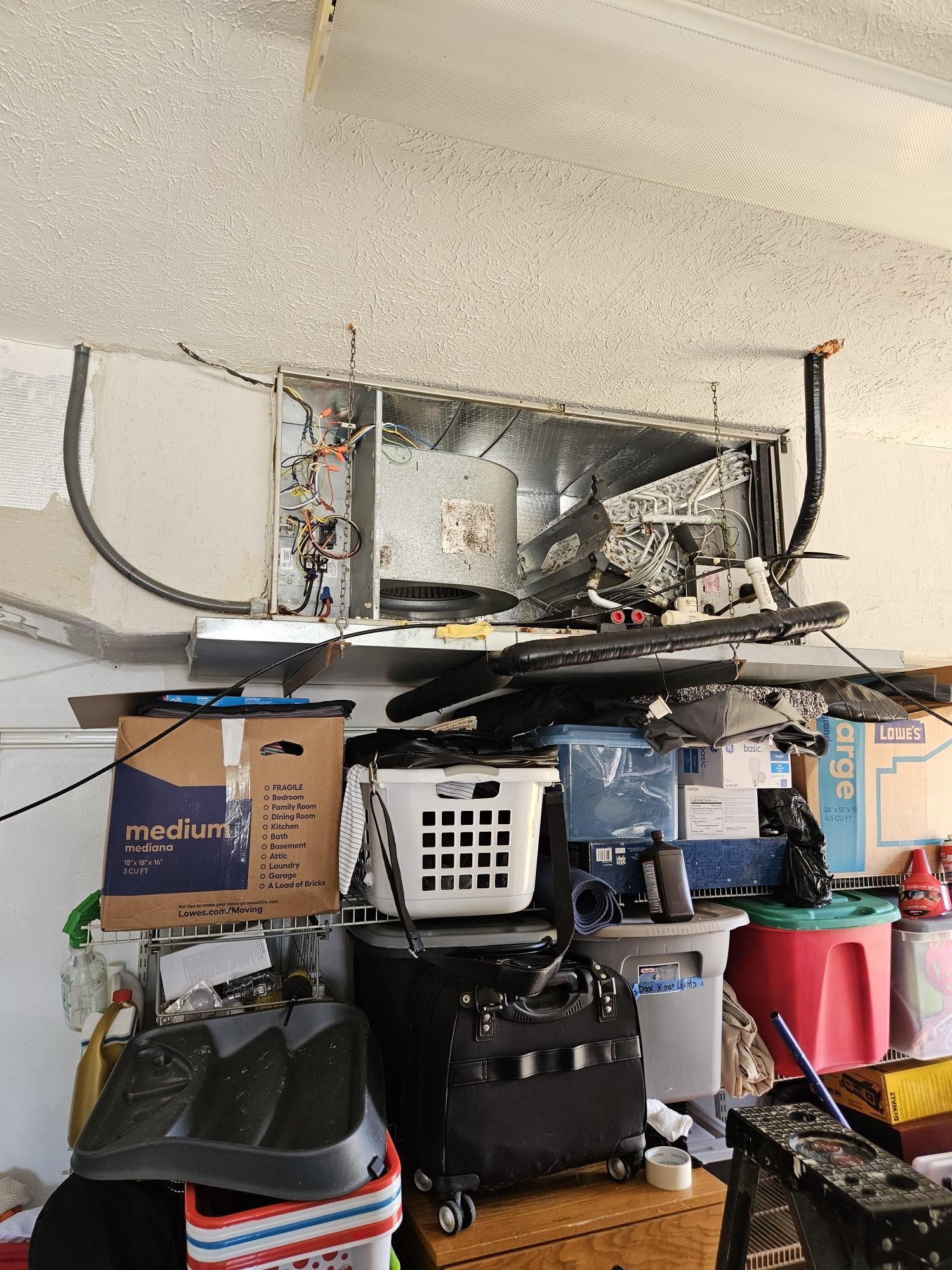 A garage filled with lots of boxes , baskets , and other items.