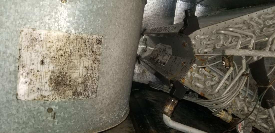 A close up of a metal object with a sticker on it.