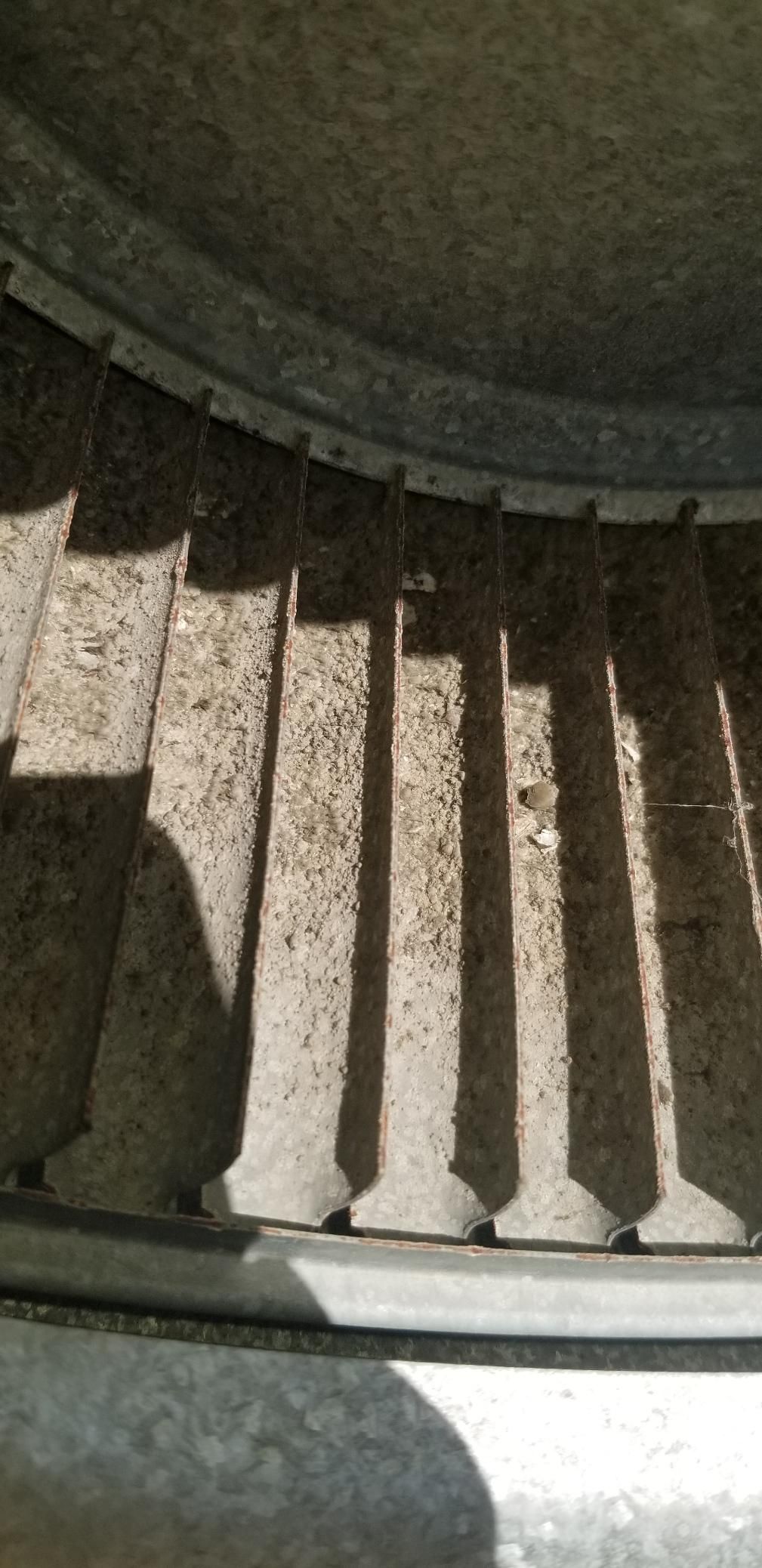 A close up of a fan with a shadow on it.