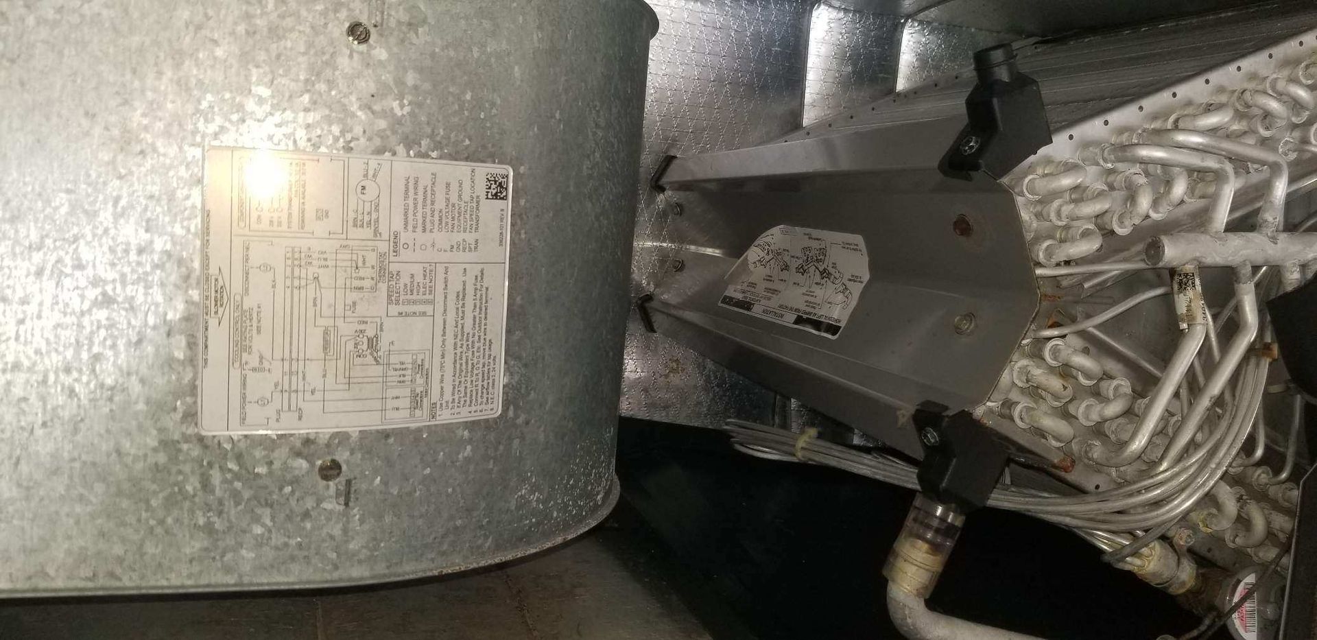 A close up of a metal object with a label on it.