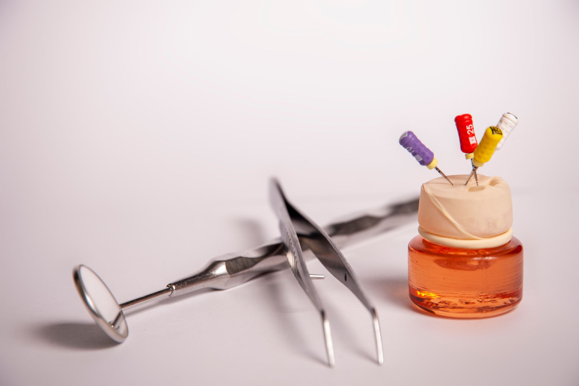A woman is getting her teeth examined by a dentist