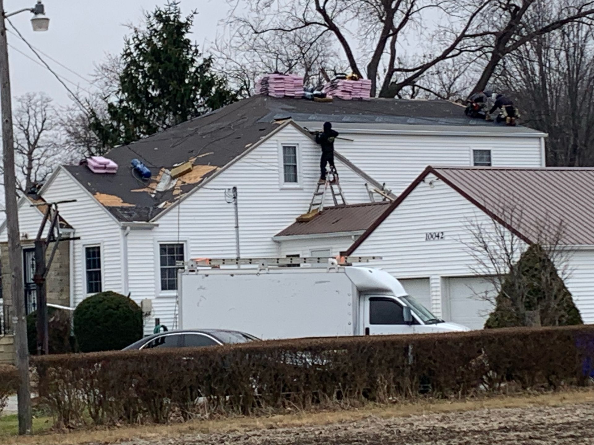Completed outdoor living space with stamped concrete, pool house