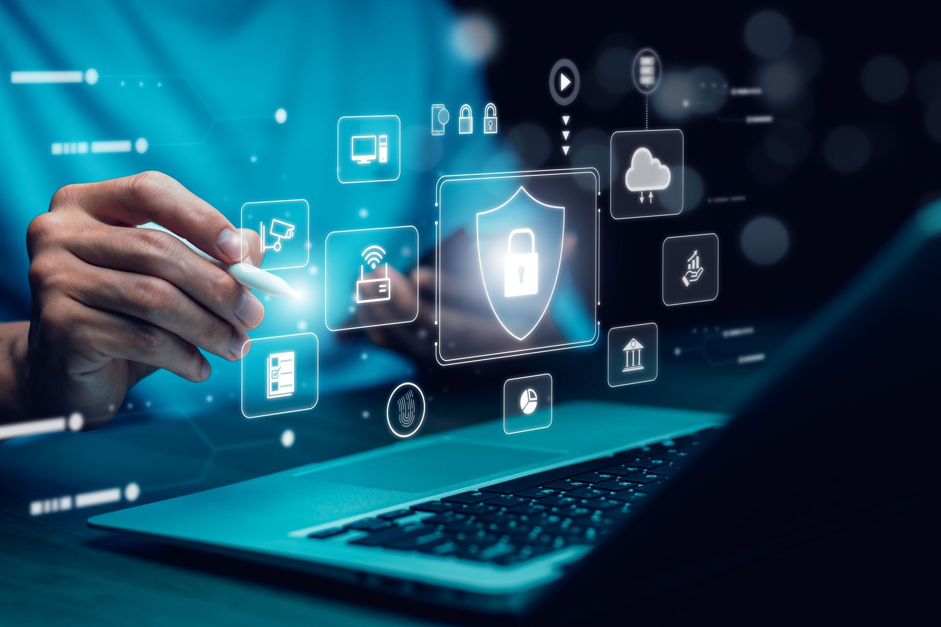 Person using a stylus on a laptop, with digital security icons overlaid.