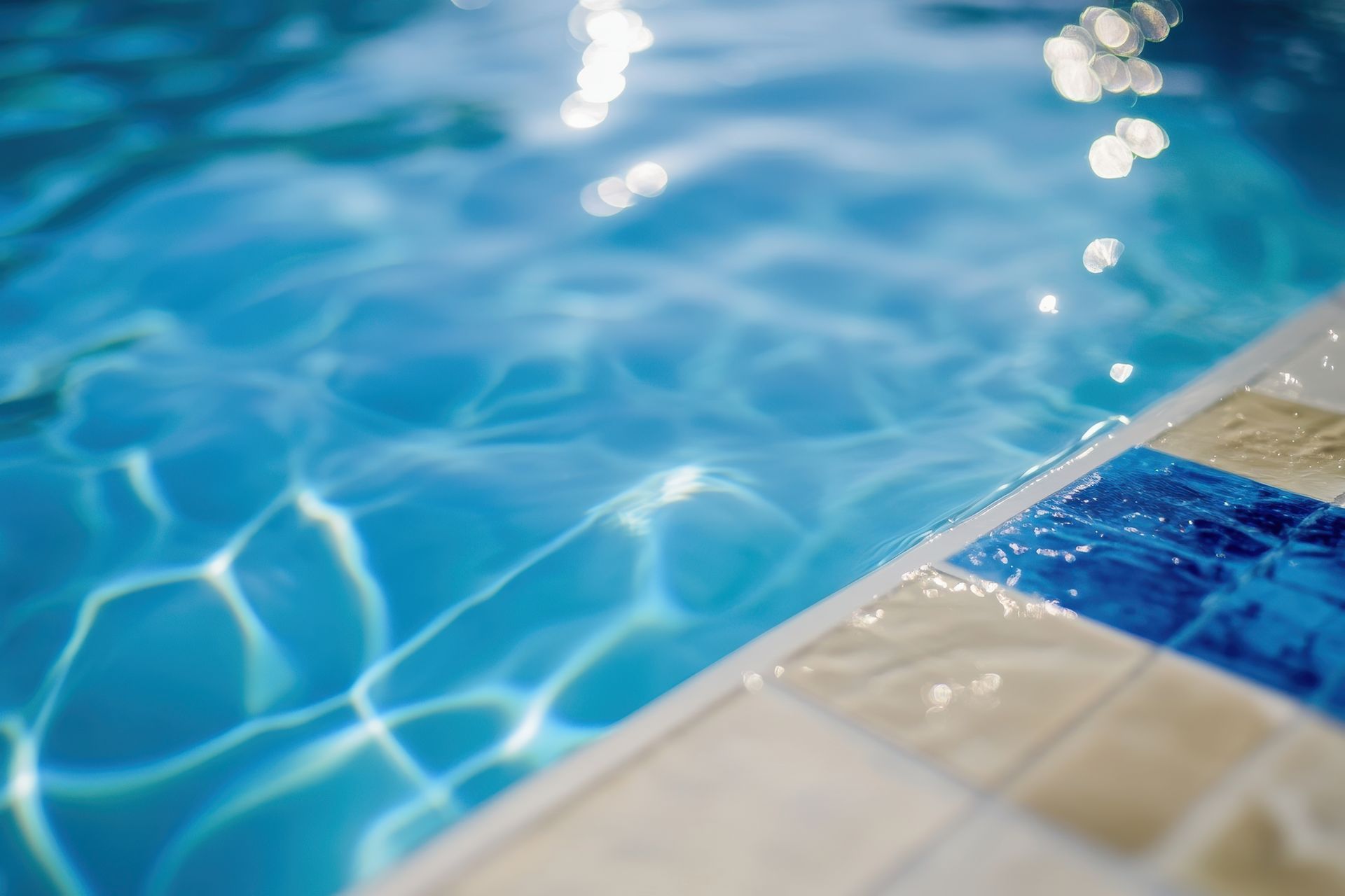 A close up of a swimming pool with blue water.
