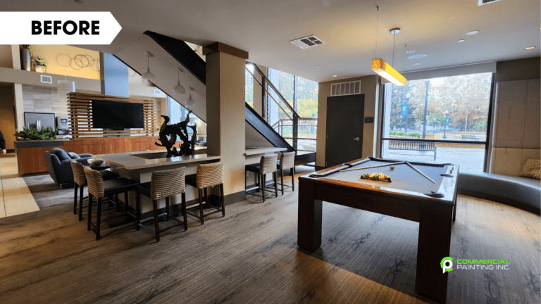 There is a pool table in the middle of the room.