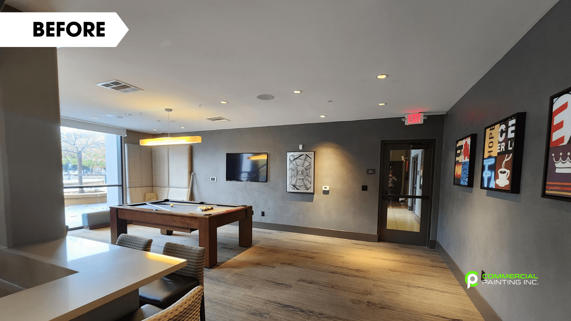 There is a pool table in the middle of the room.