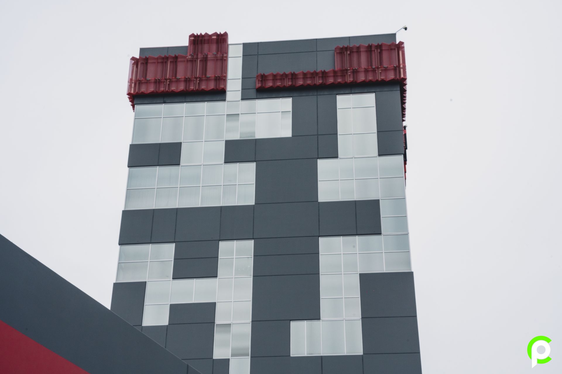 A black and white building with the letter p on it