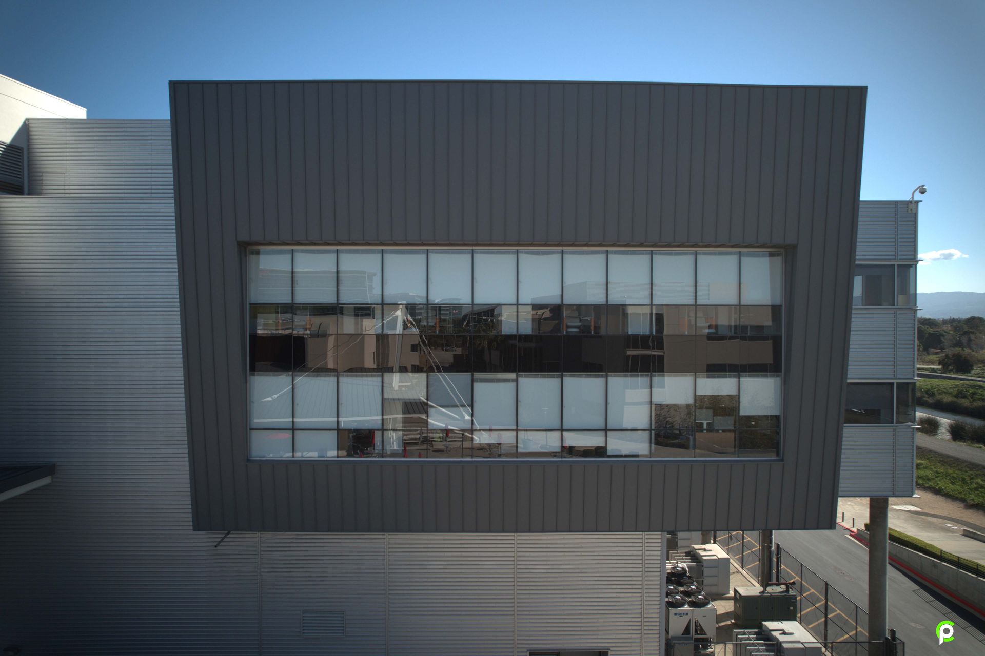 An aerial view of a large building with a lot of windows.