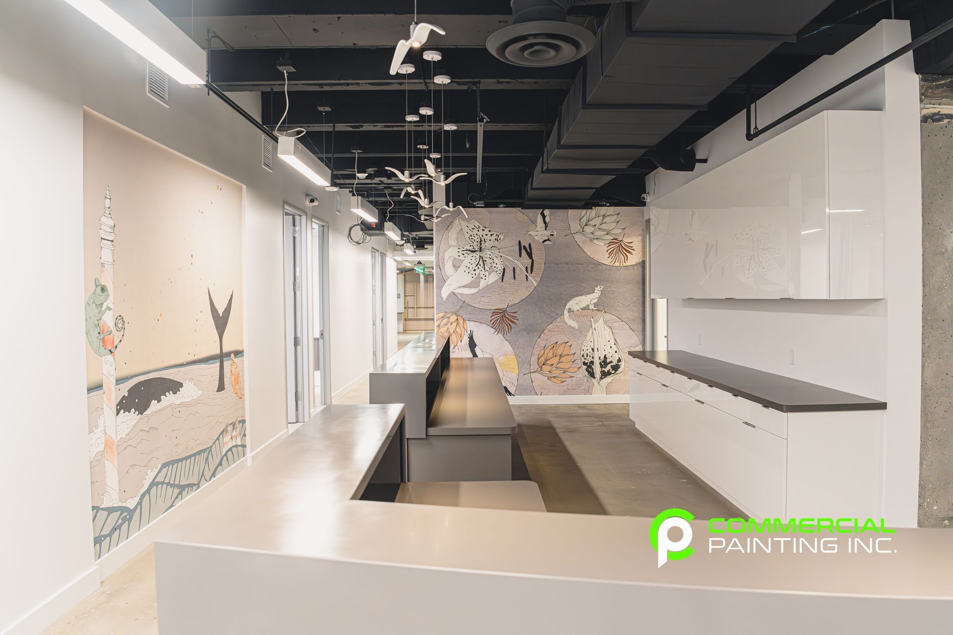 A long hallway with a large painting on the wall.