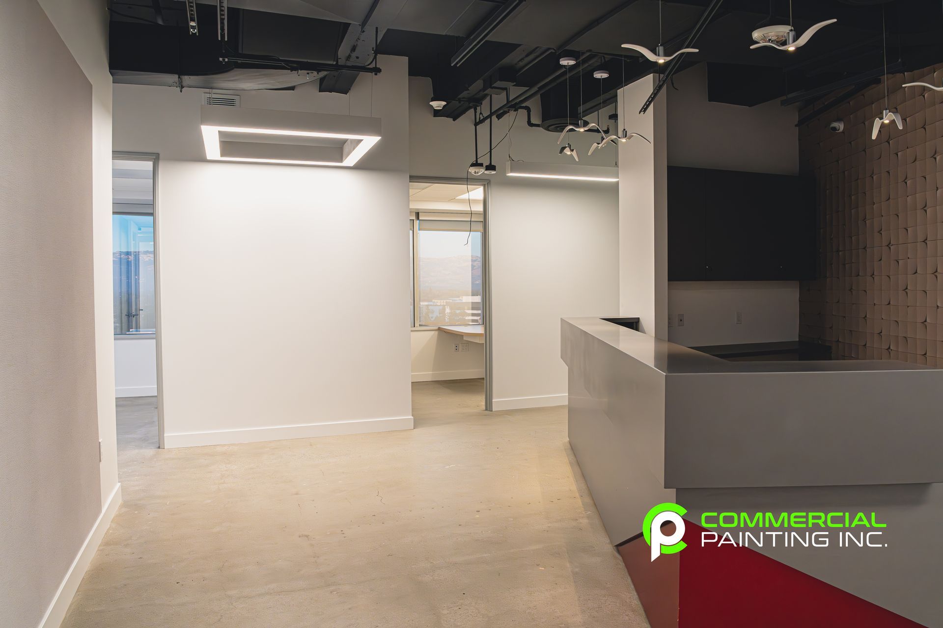 There is a reception desk in the middle of the room.