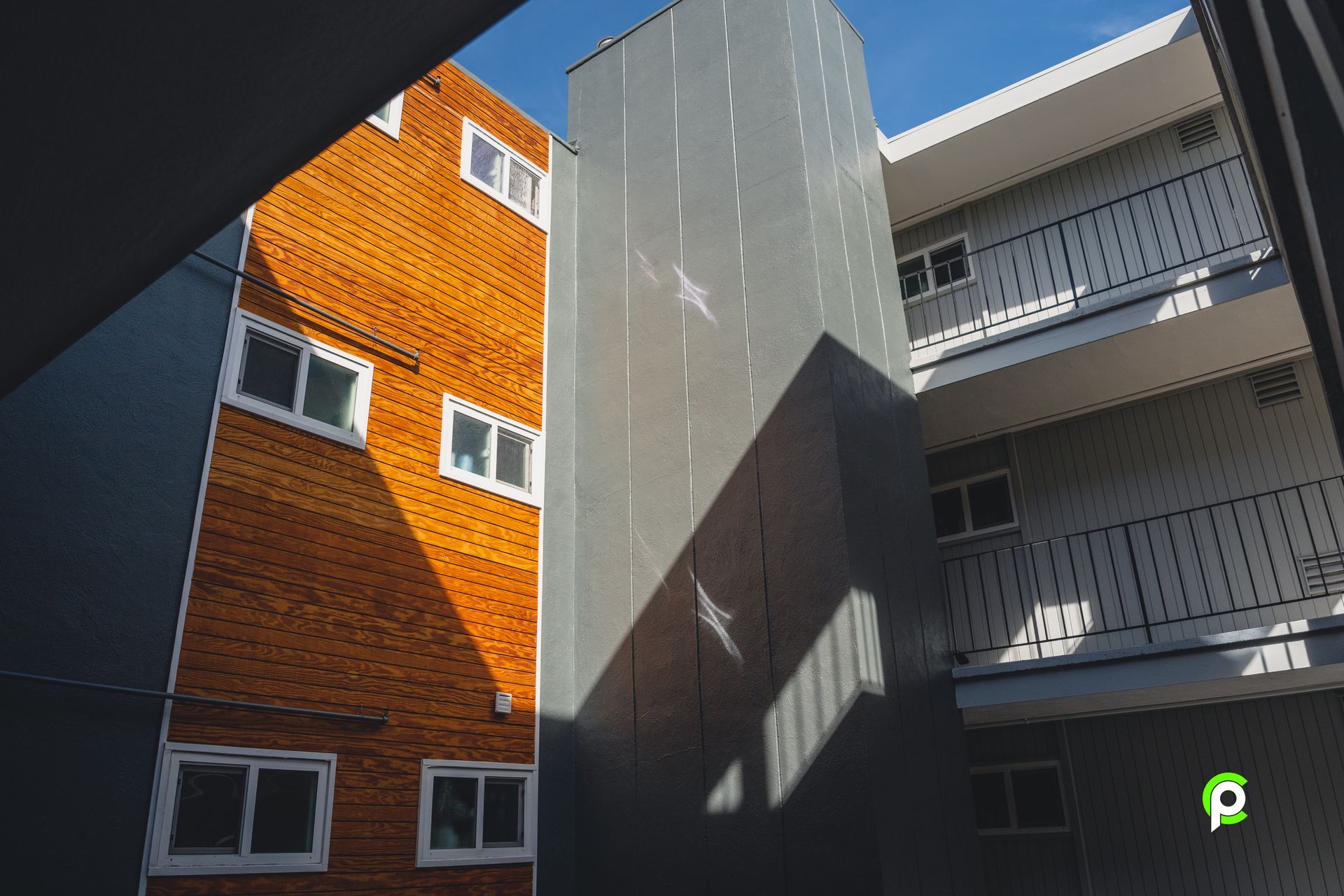 Looking up at a building with the letter p on it