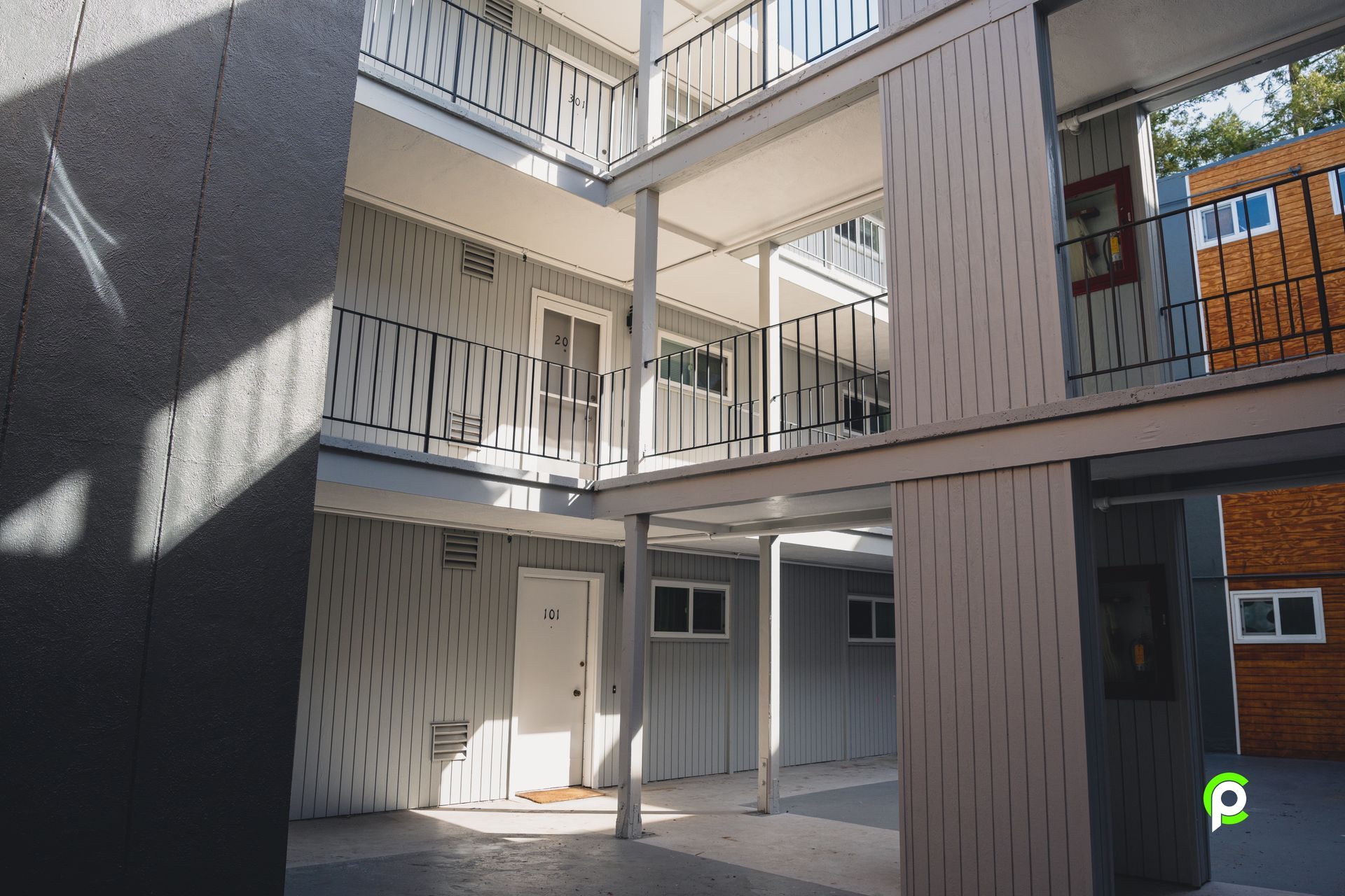 The sun is shining through the windows of a building