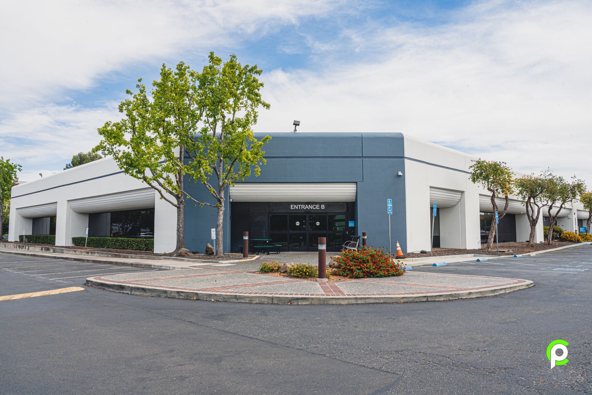 A large building with a parking lot in front of it
