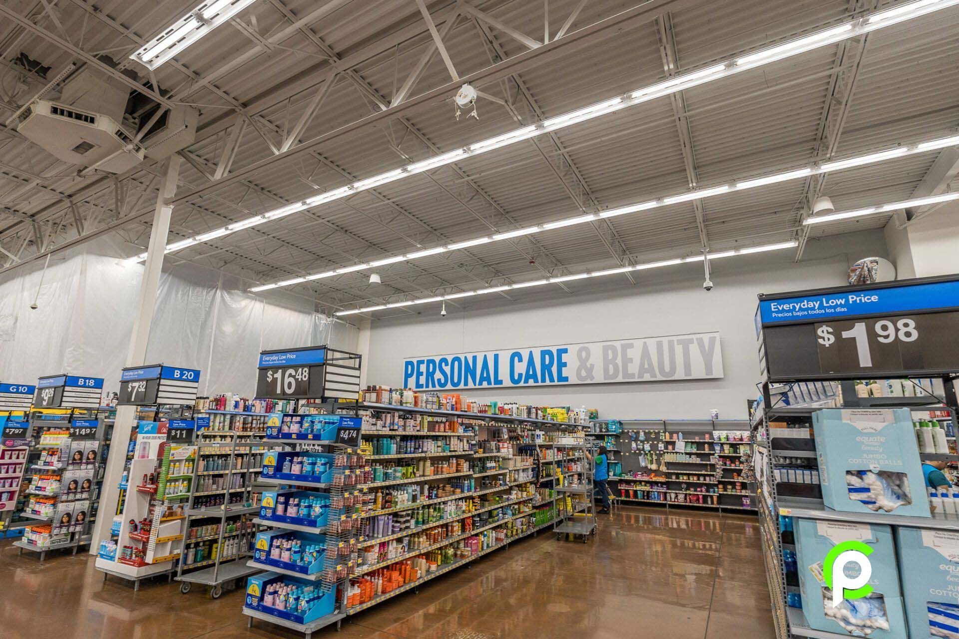 The inside of a walmart store with a personal care and beauty section.