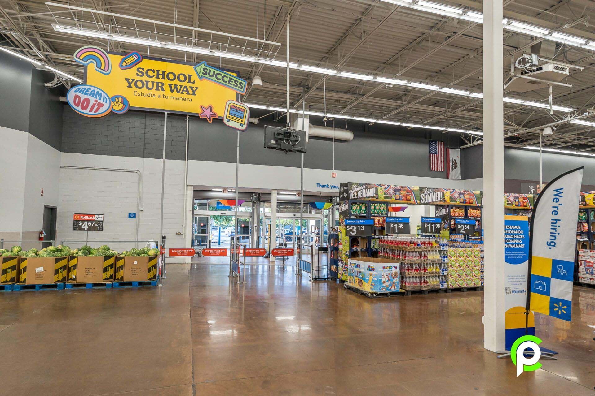 A large empty store with a sign that says `` school your way ''.