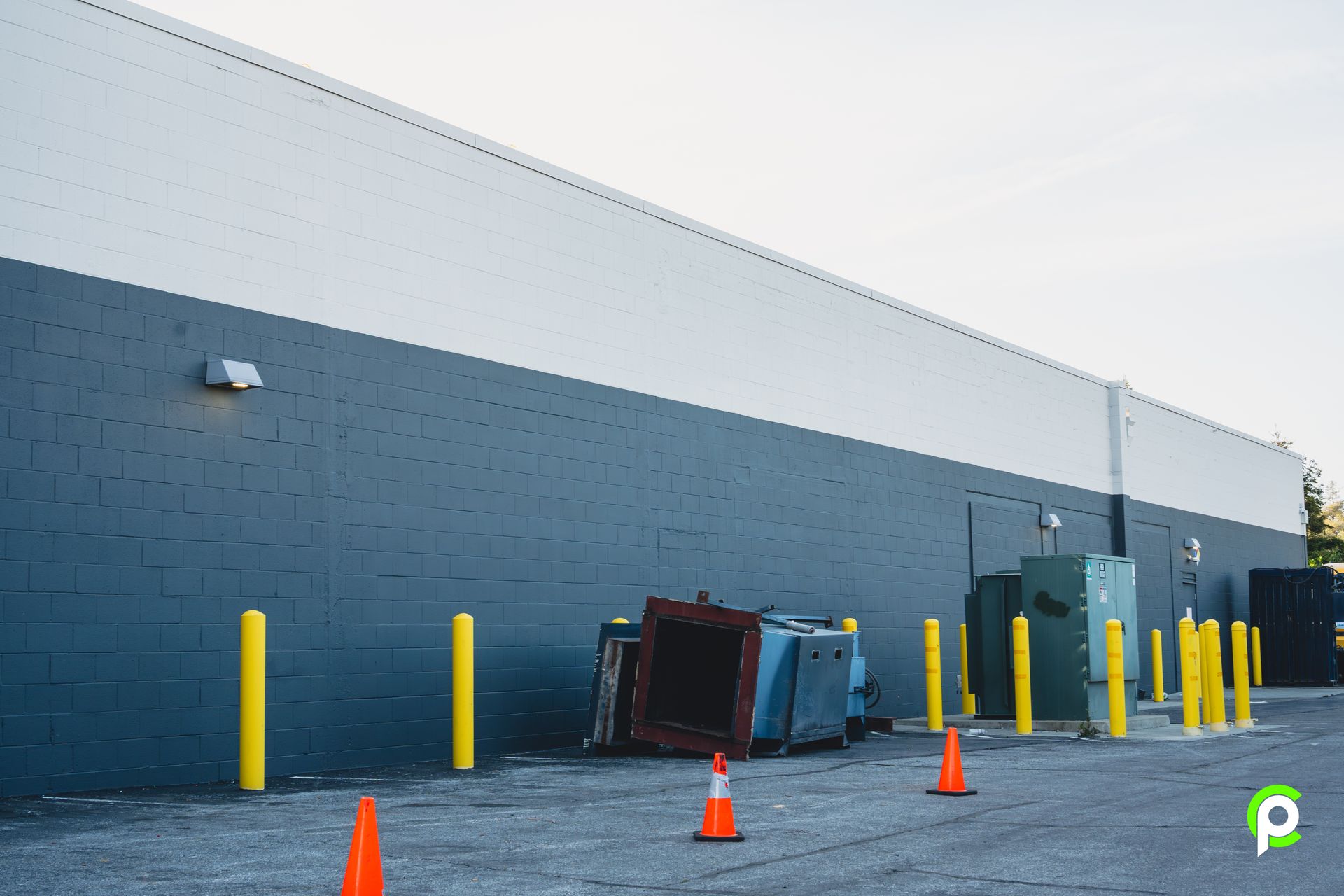 A building with a lot of orange cones in front of it