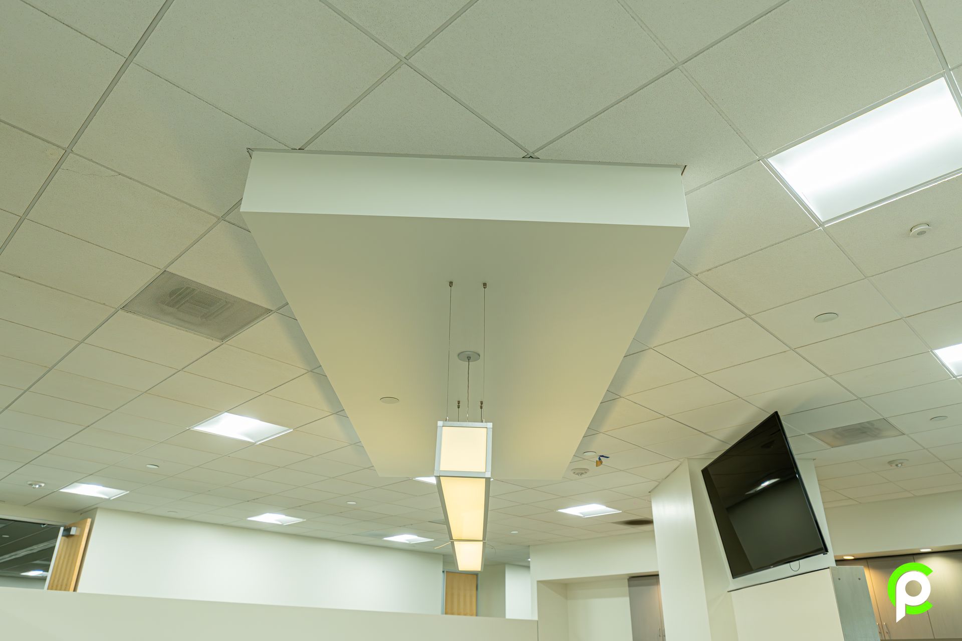 A white ceiling with a light hanging from it