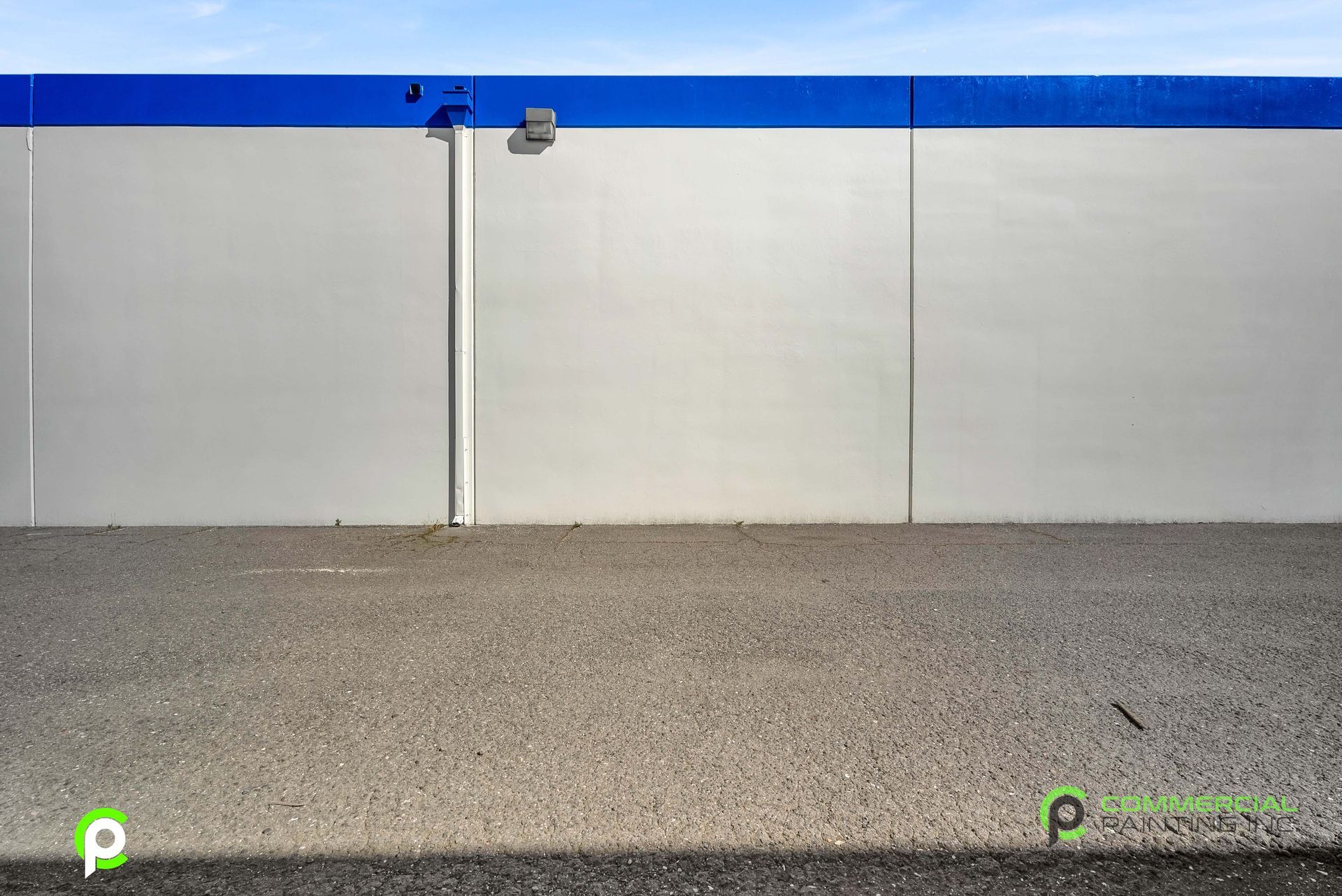 A white wall with a blue stripe on the side of it.