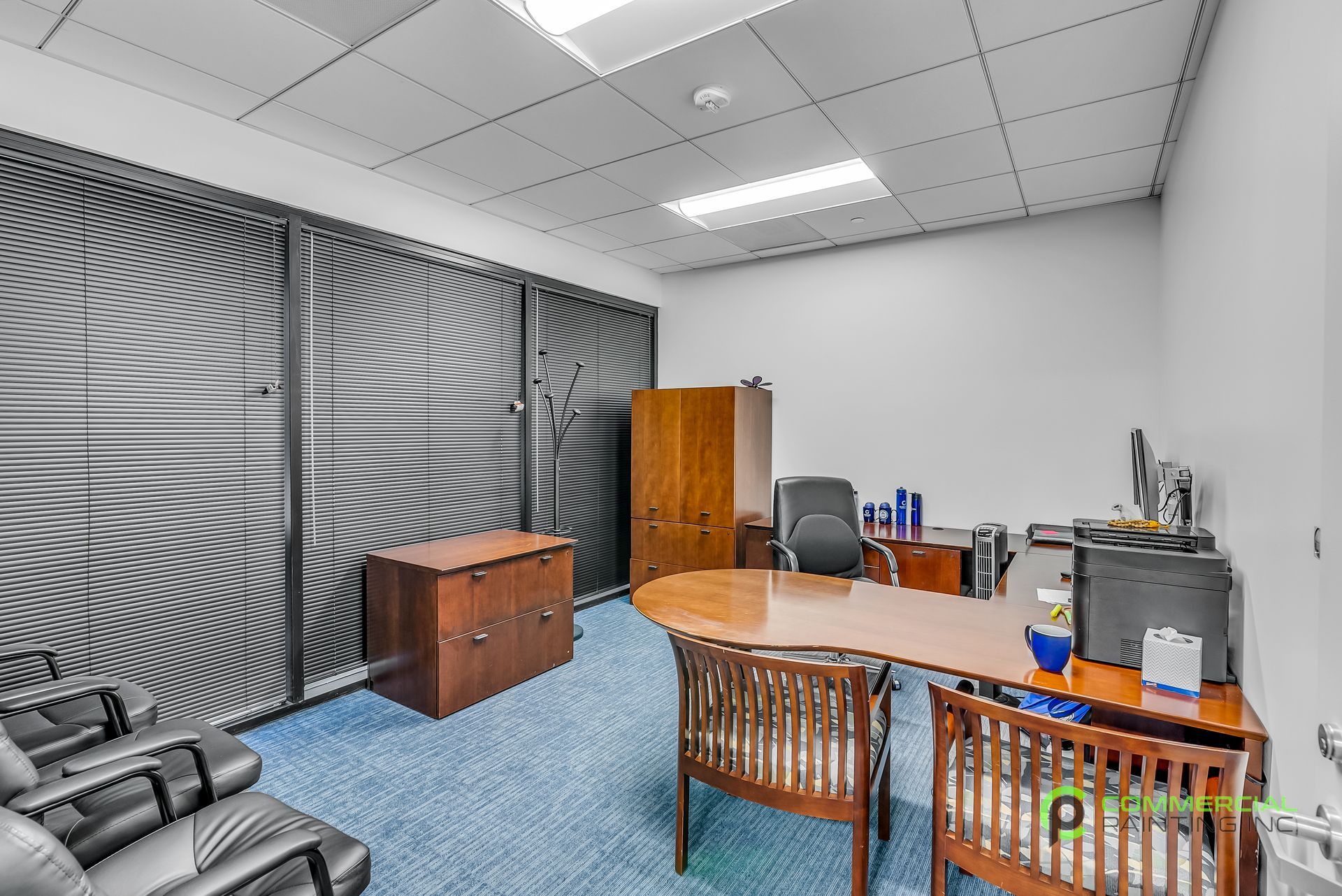 A room with a table and chairs in it