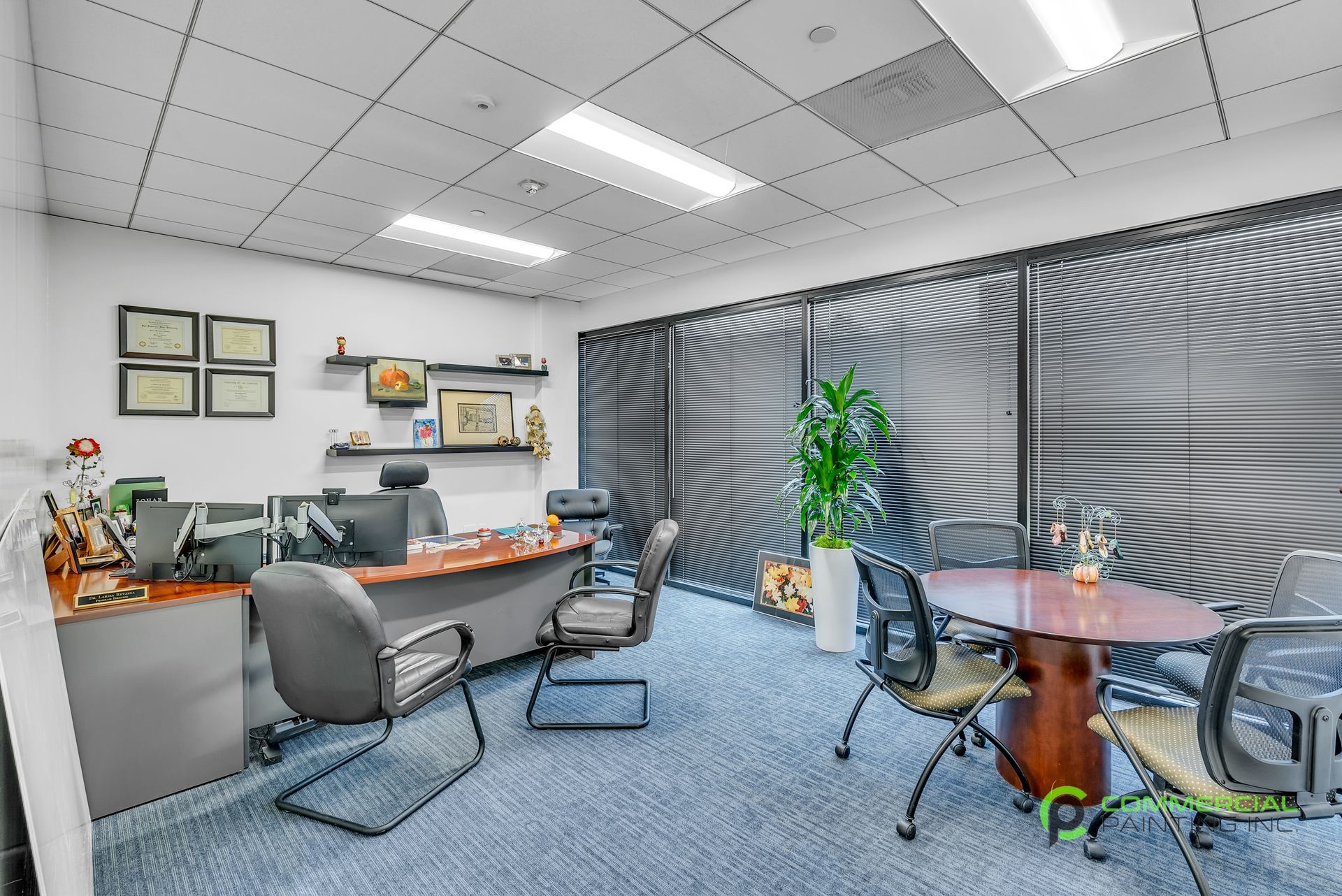 There is a table and chairs in the middle of the room.