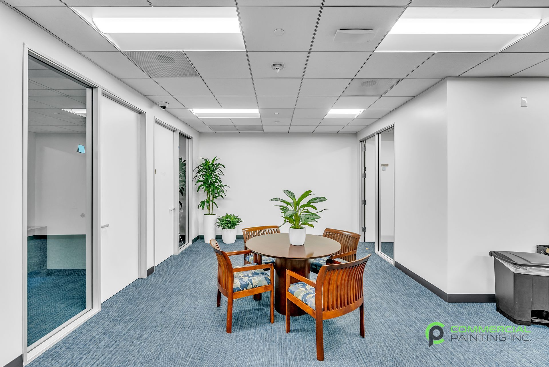 A room with a table and chairs in it