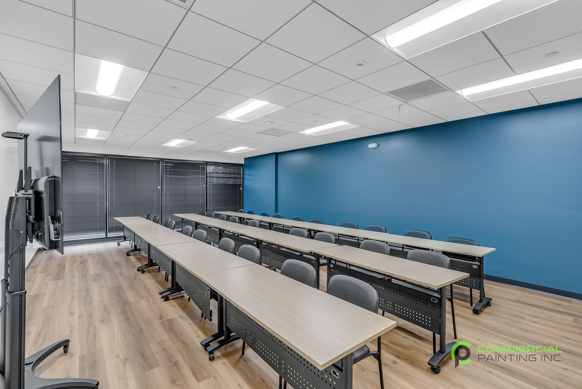 There are a lot of tables and chairs in this room.