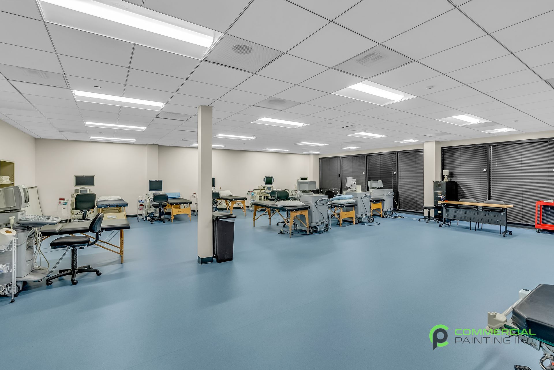 A large room with a lot of tables and chairs in it