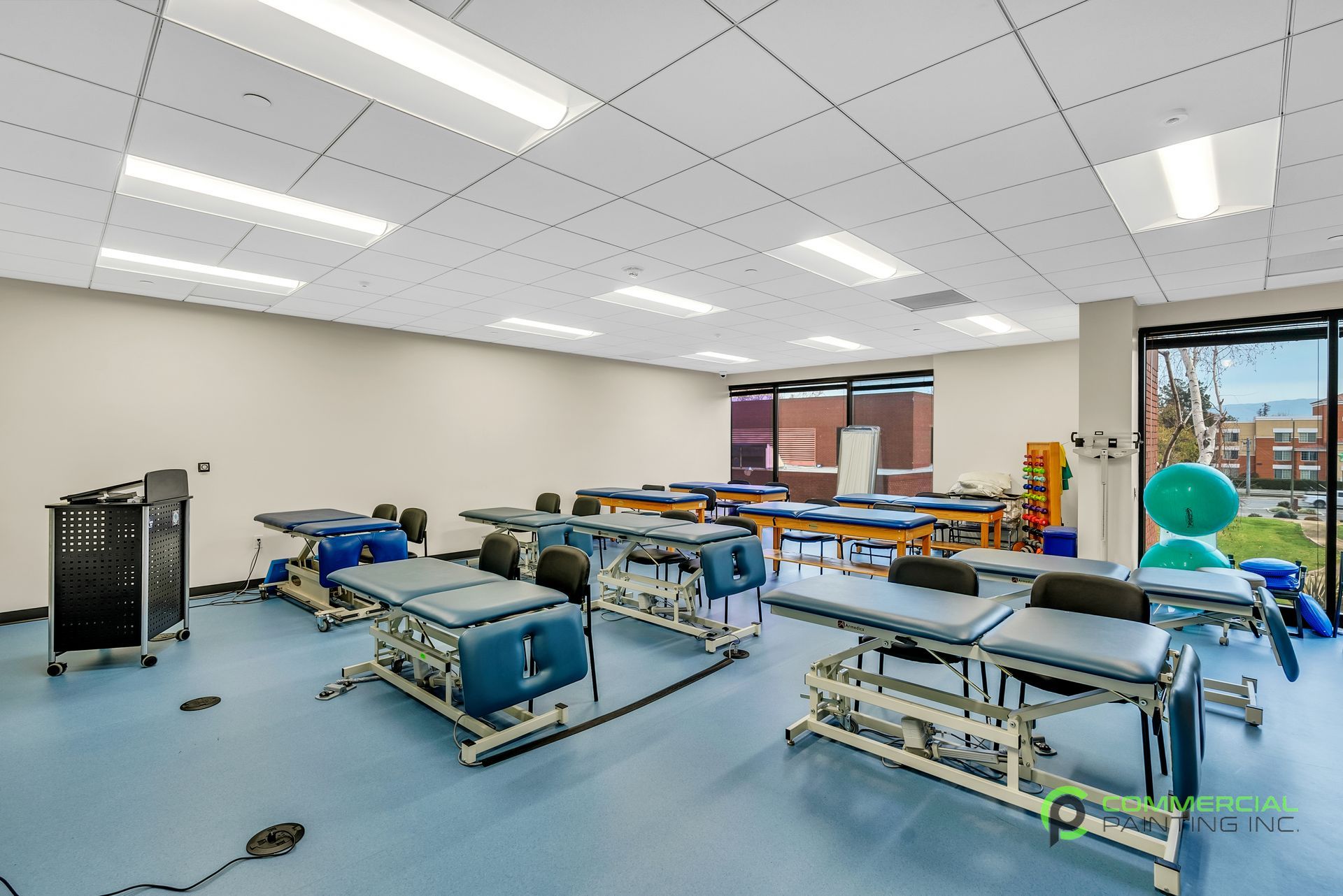 A room with a lot of tables and chairs in it