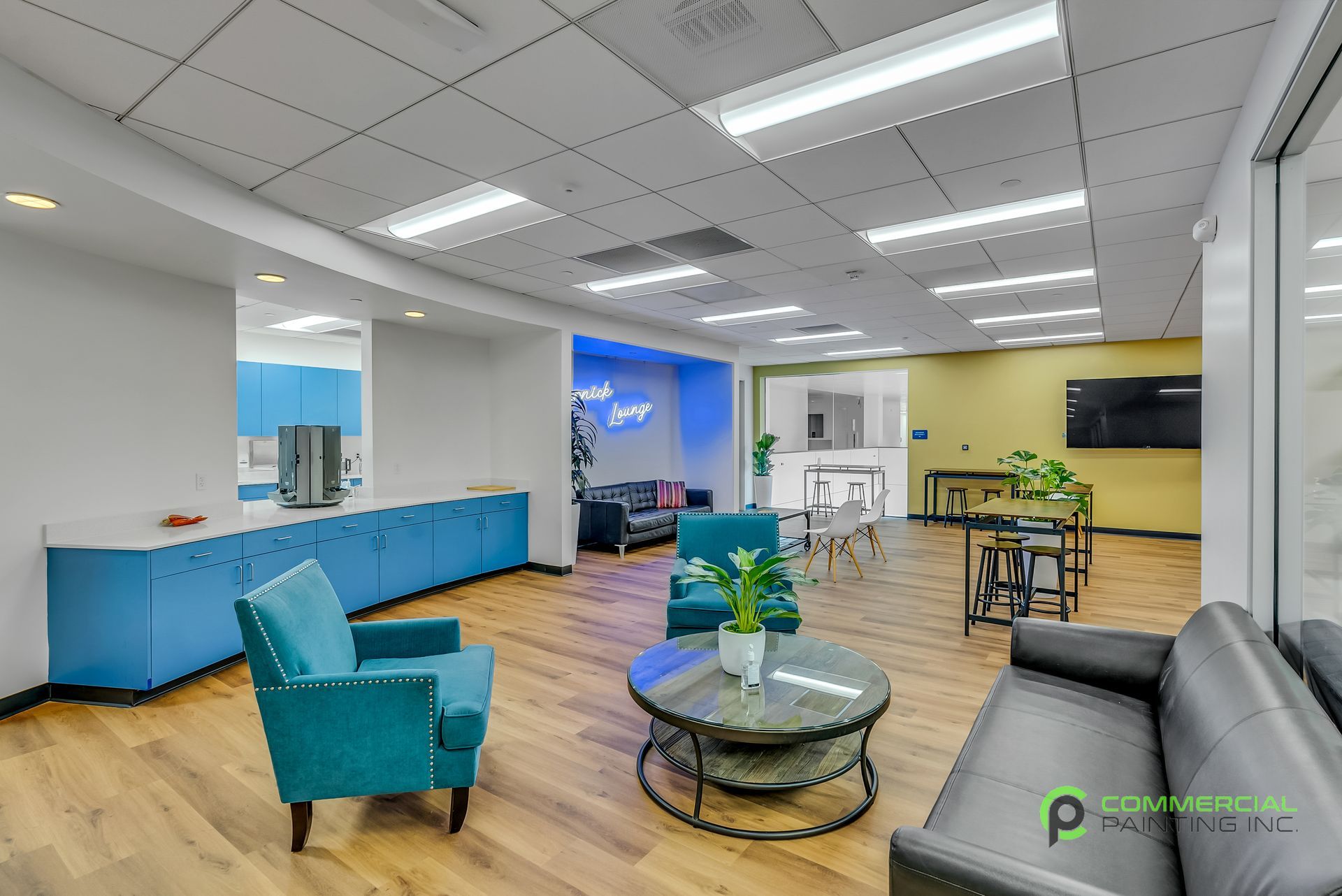 A living room with a couch , chairs , and a coffee table.