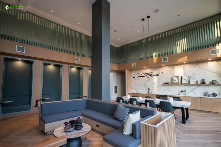 A living room with a couch , table and chairs