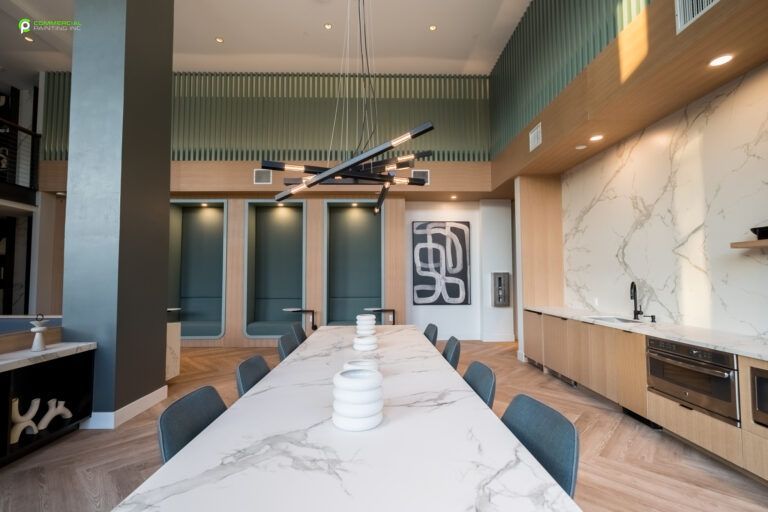 There is a large table in the middle of the room.