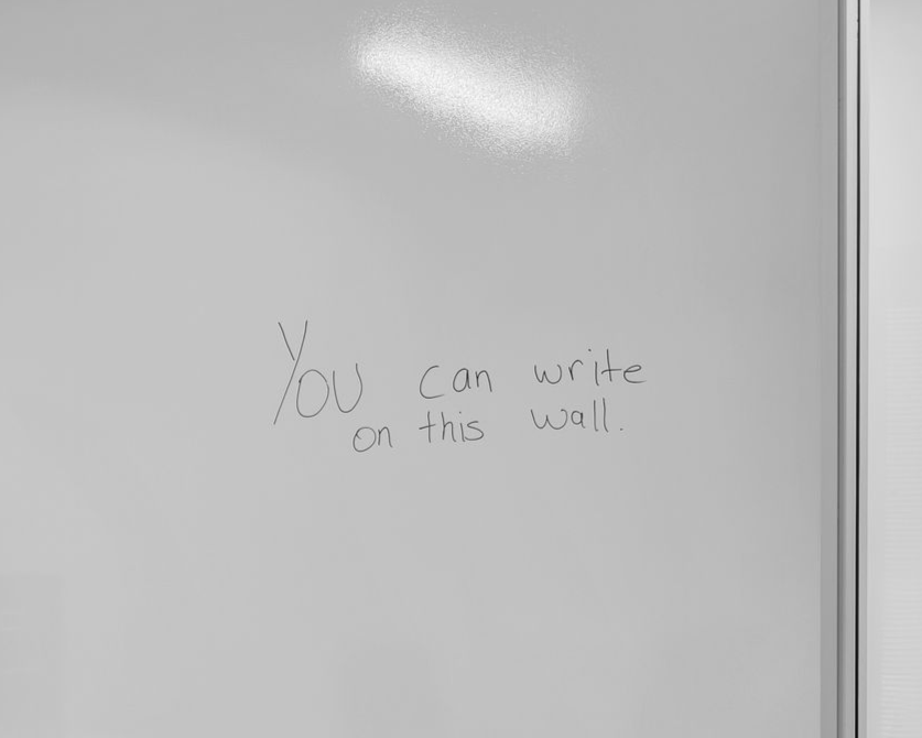 Modern conference room with full-scale writable wall