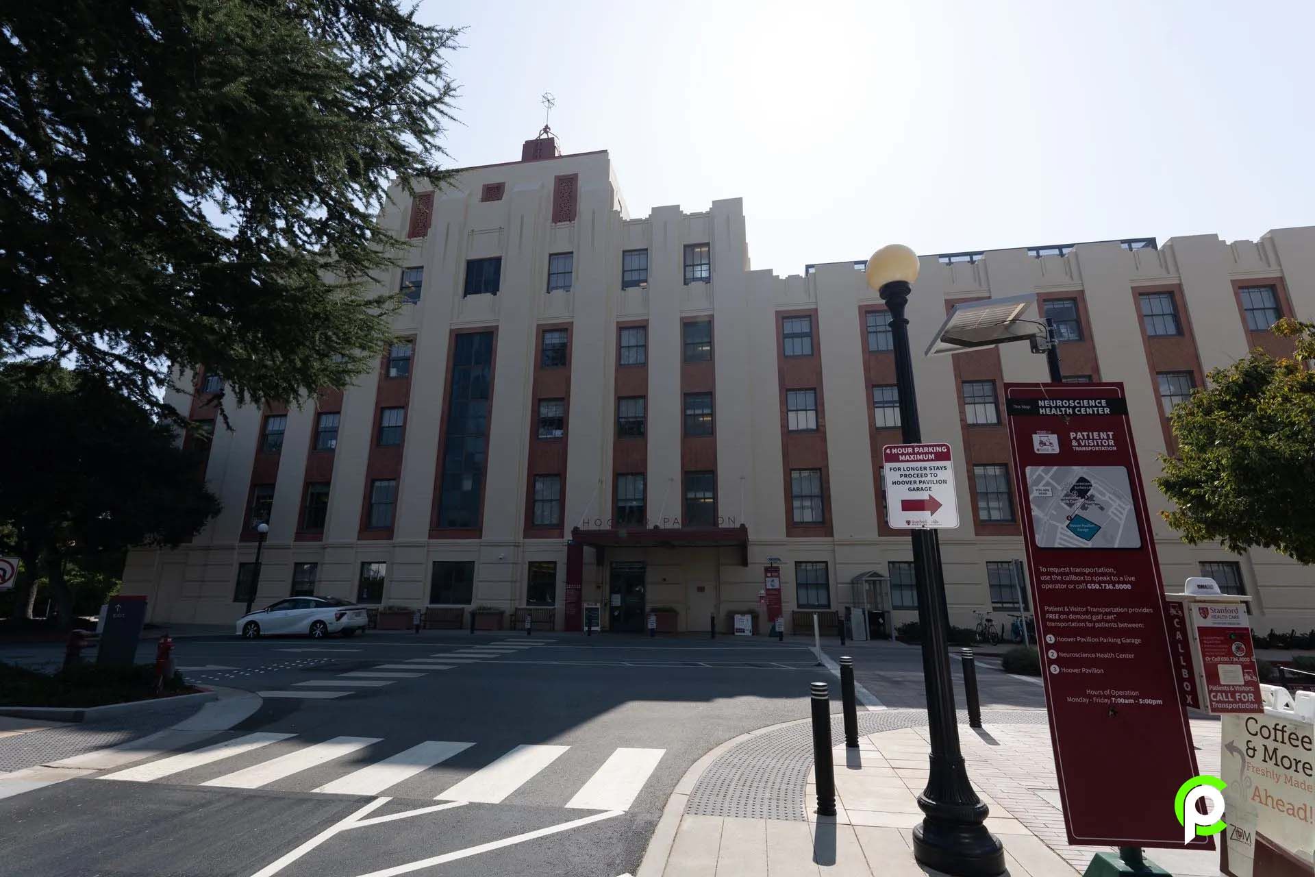 A large building with a no parking sign in front of it