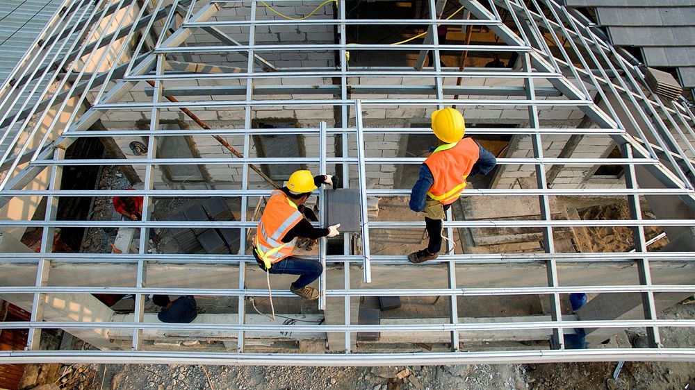 Two Construction Workers on Scaffolding a Roof — Newcastle Roofing Wizards In Tingira Heights, NSW