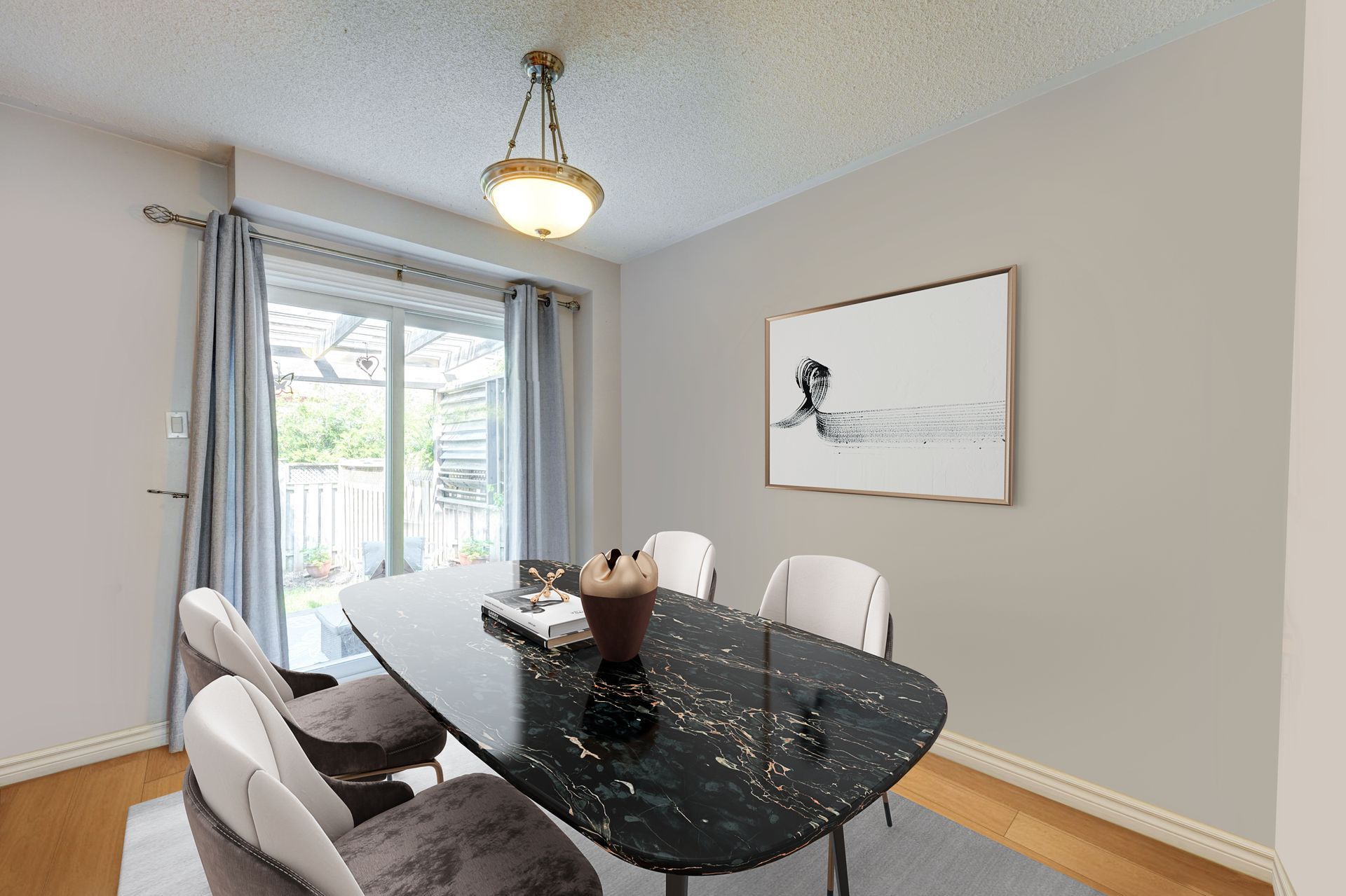 A dining room with a table and chairs and a picture on the wall.