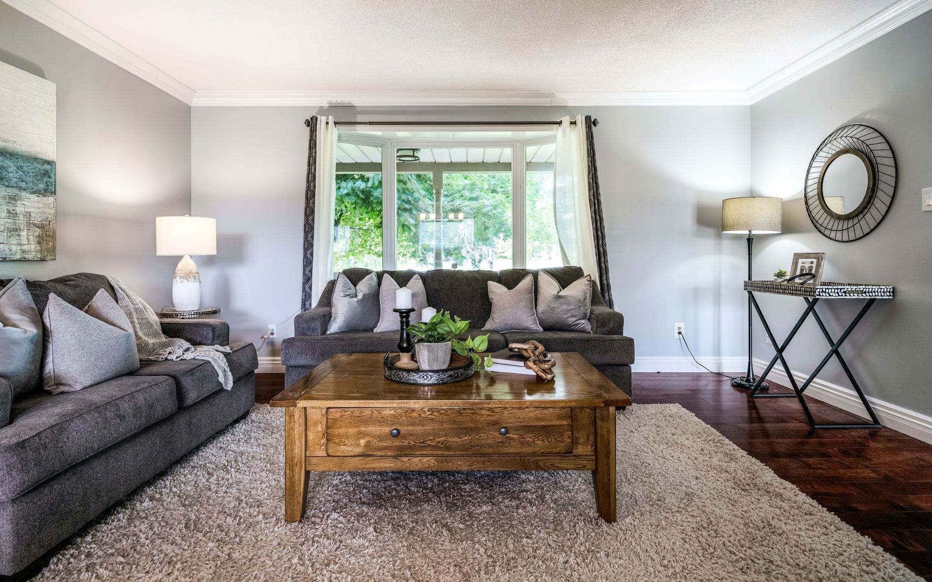A living room with a couch , coffee table , and rug.