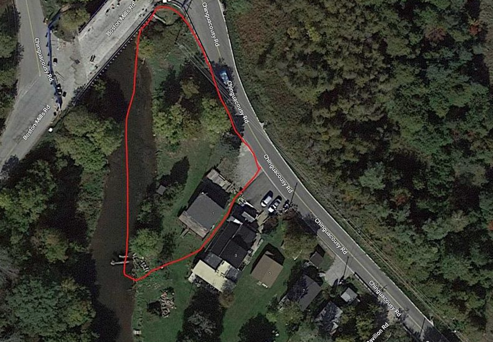 An aerial view of a house with a red circle around it