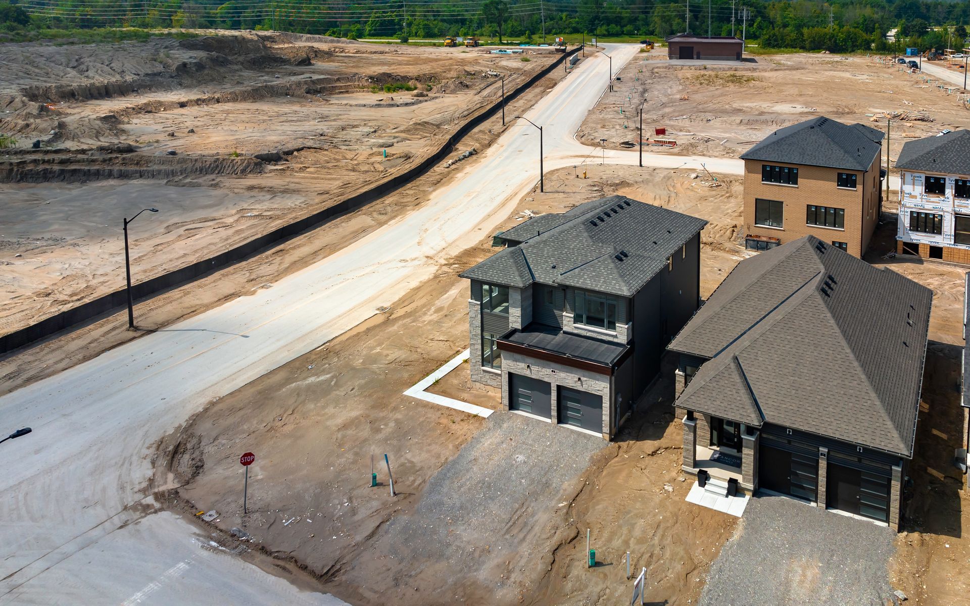 An aerial view of a residential area with houses under construction