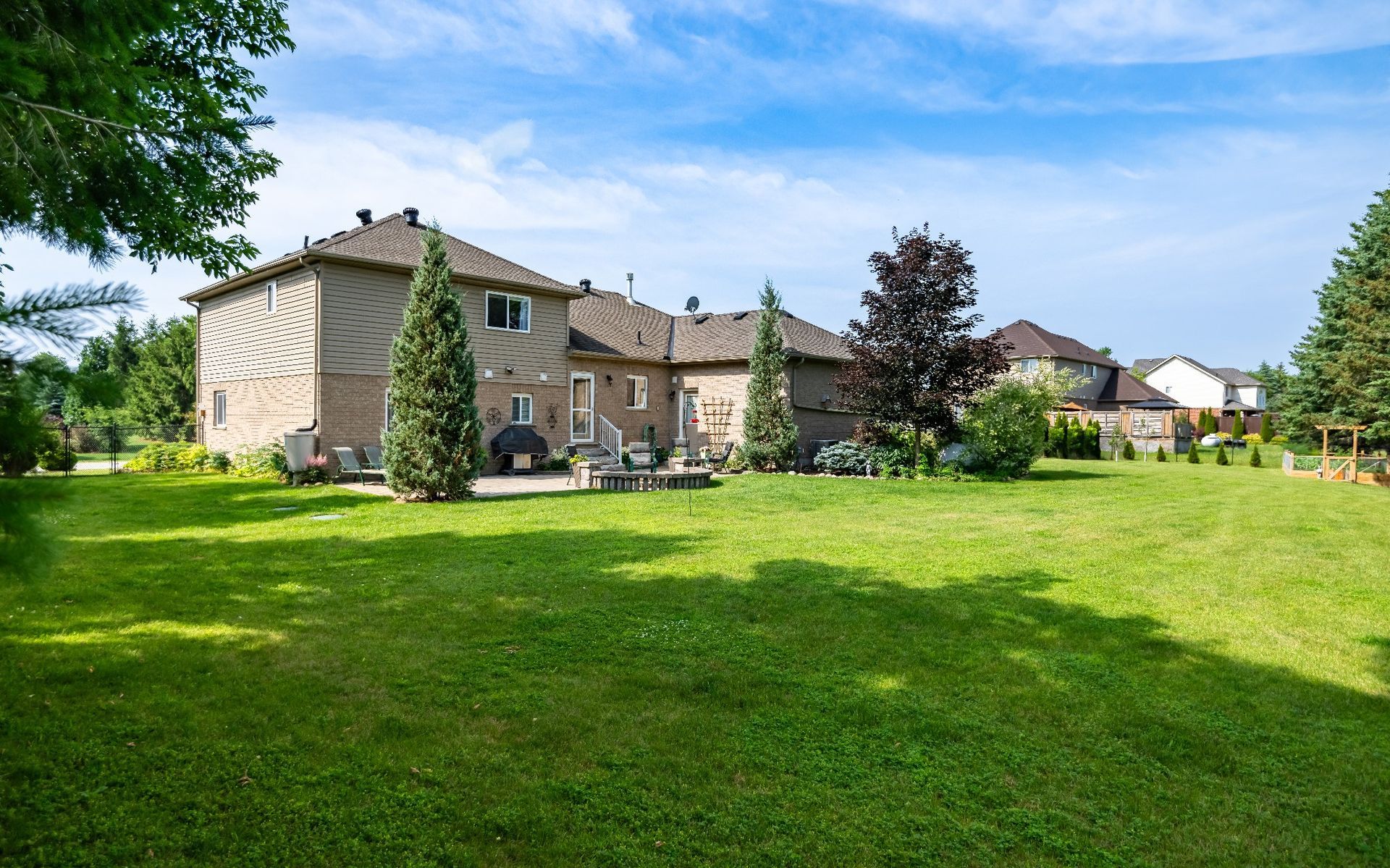 A large house with a large lawn in front of it