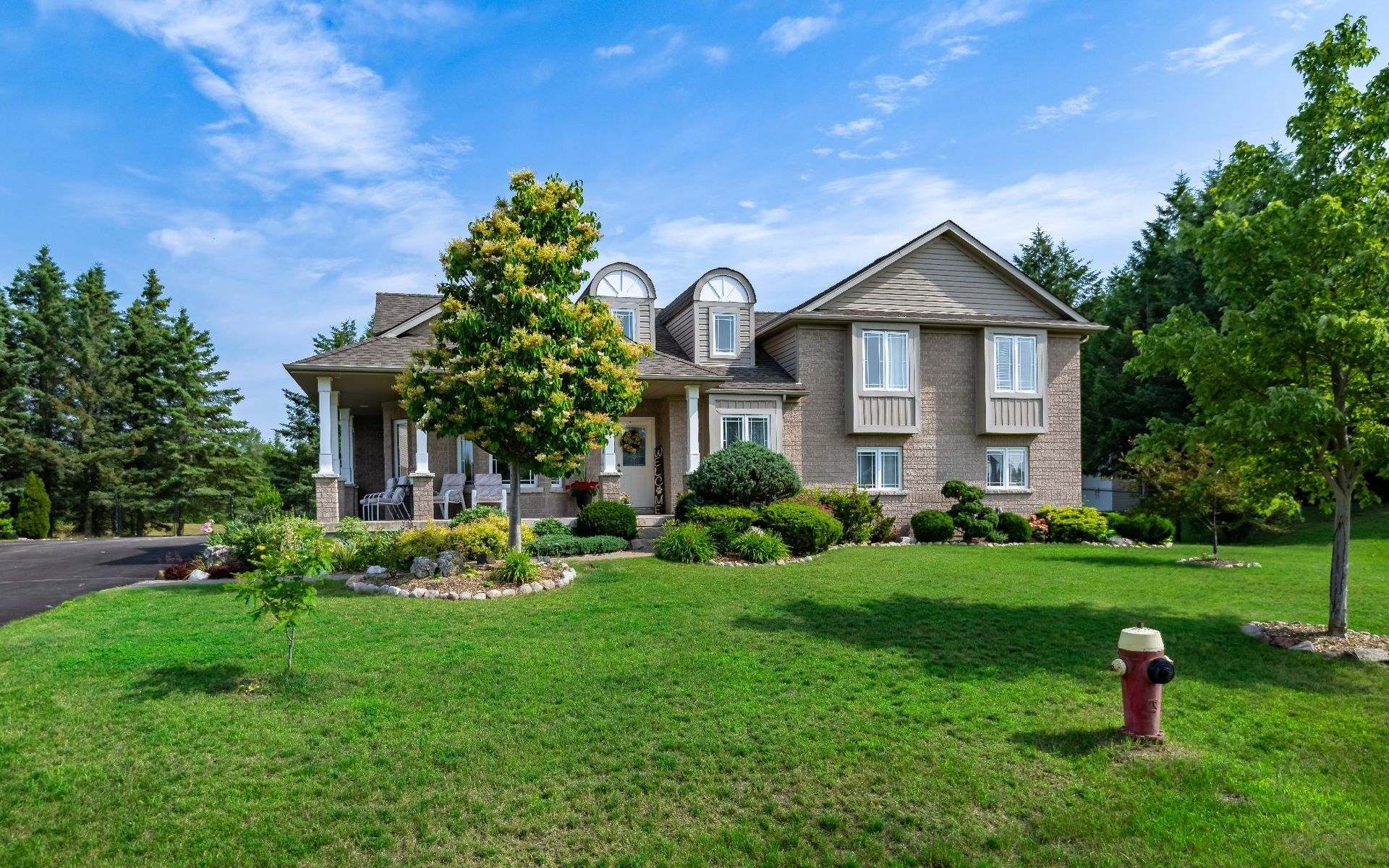 A large house with a fire hydrant in front of it