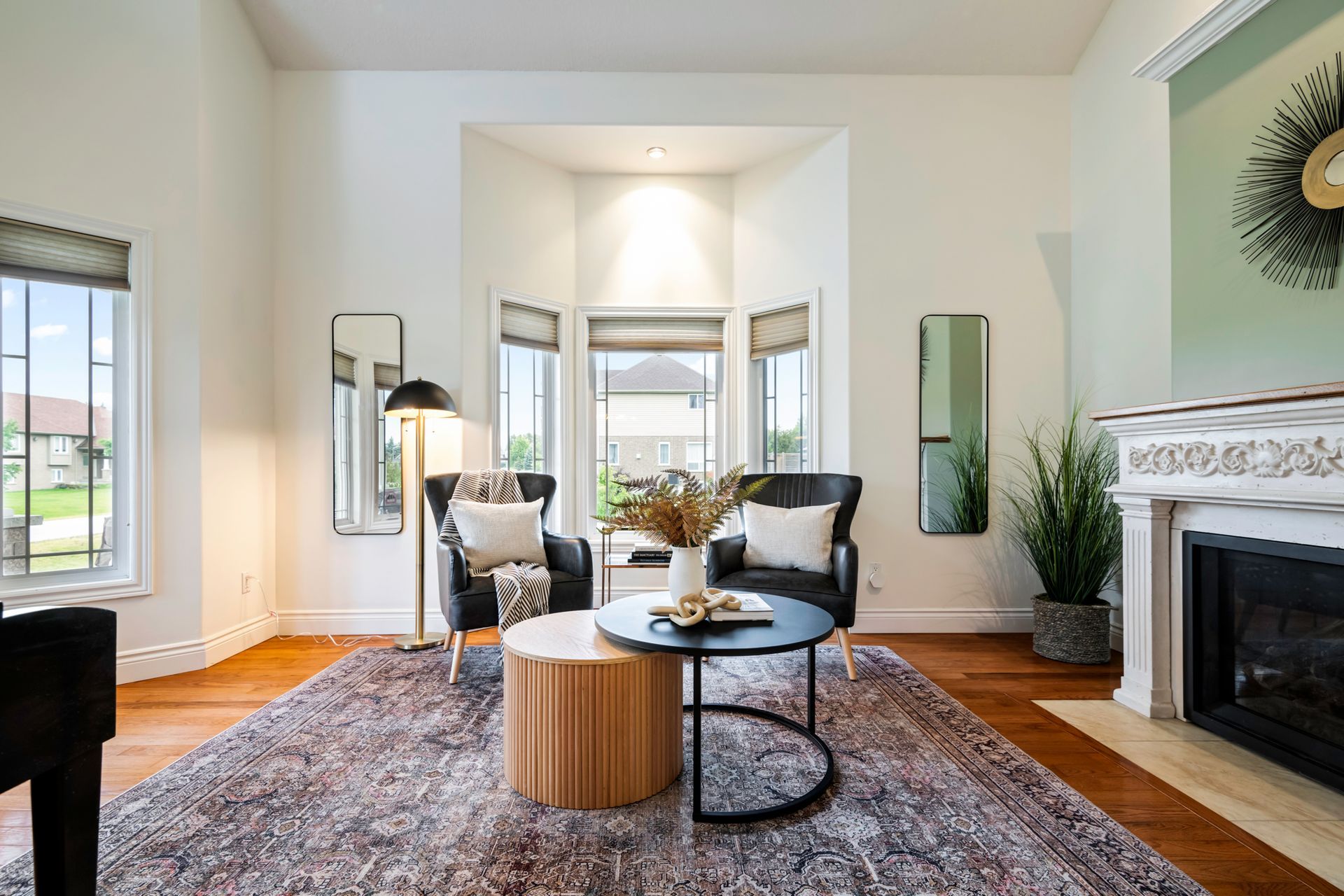 A living room filled with furniture and a fireplace.