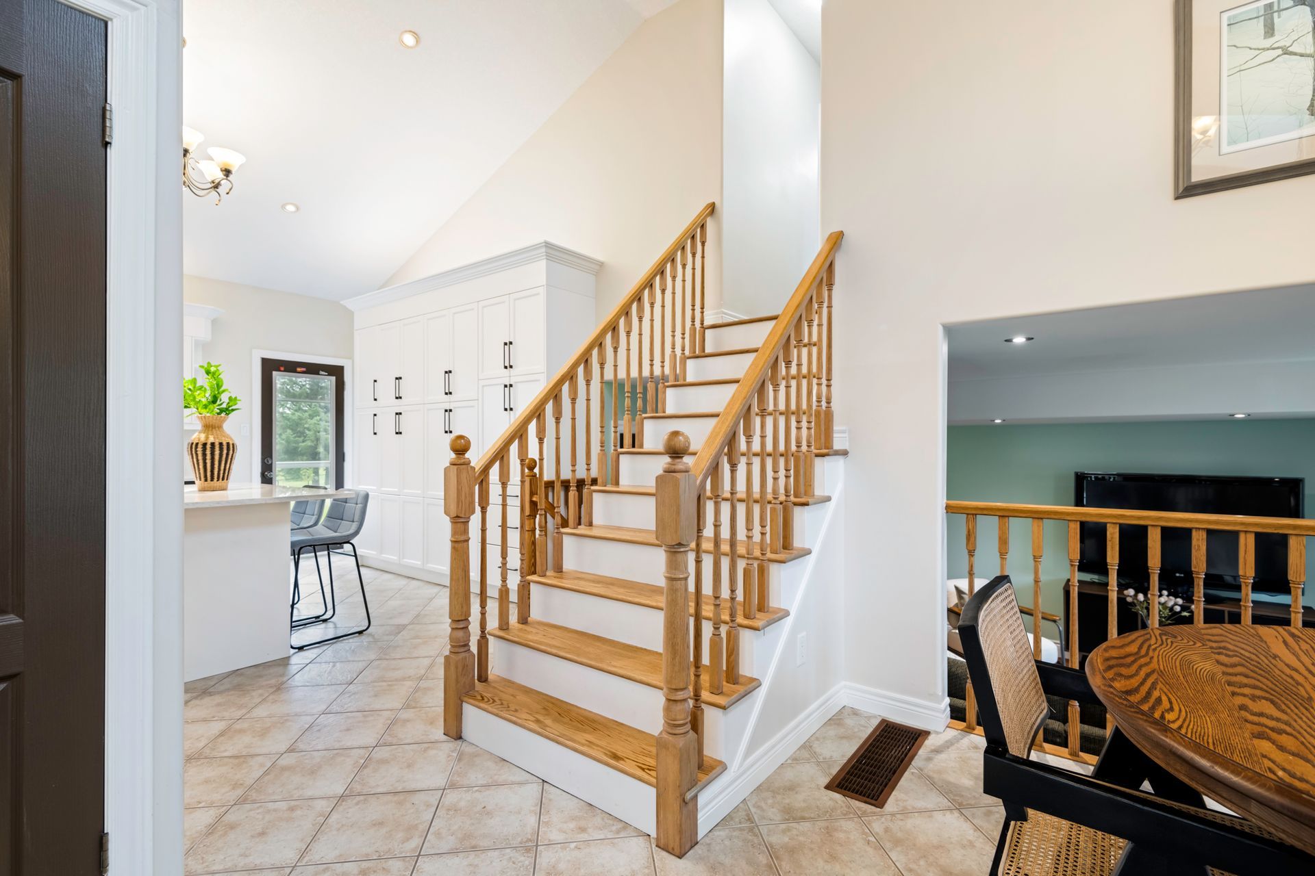 A wooden staircase leading up to the second floor of a house.