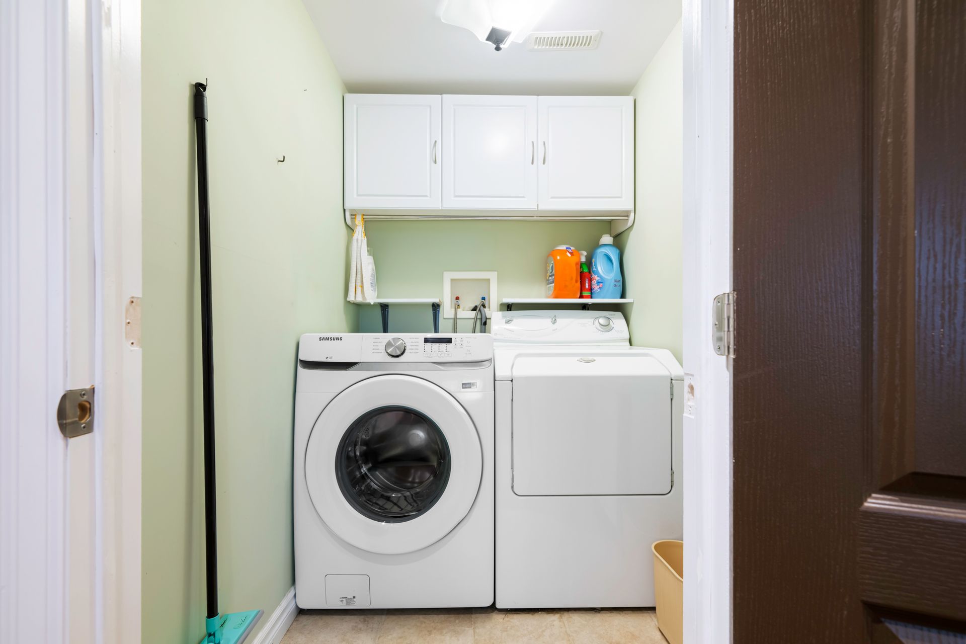 A laundry room with a washer and dryer in it.